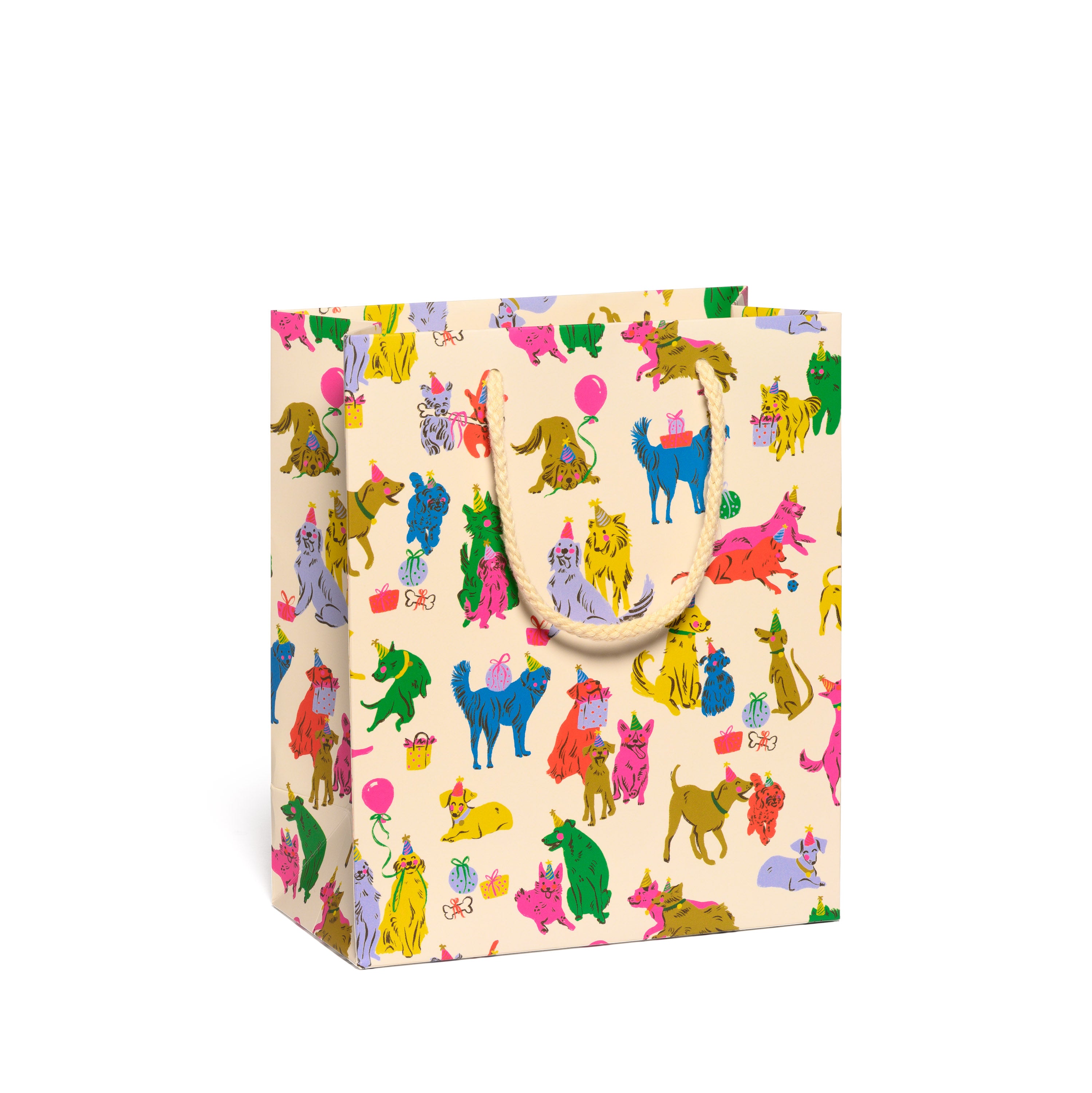 Medium sized Gift bag with colorful dog party pattern on a tan background.