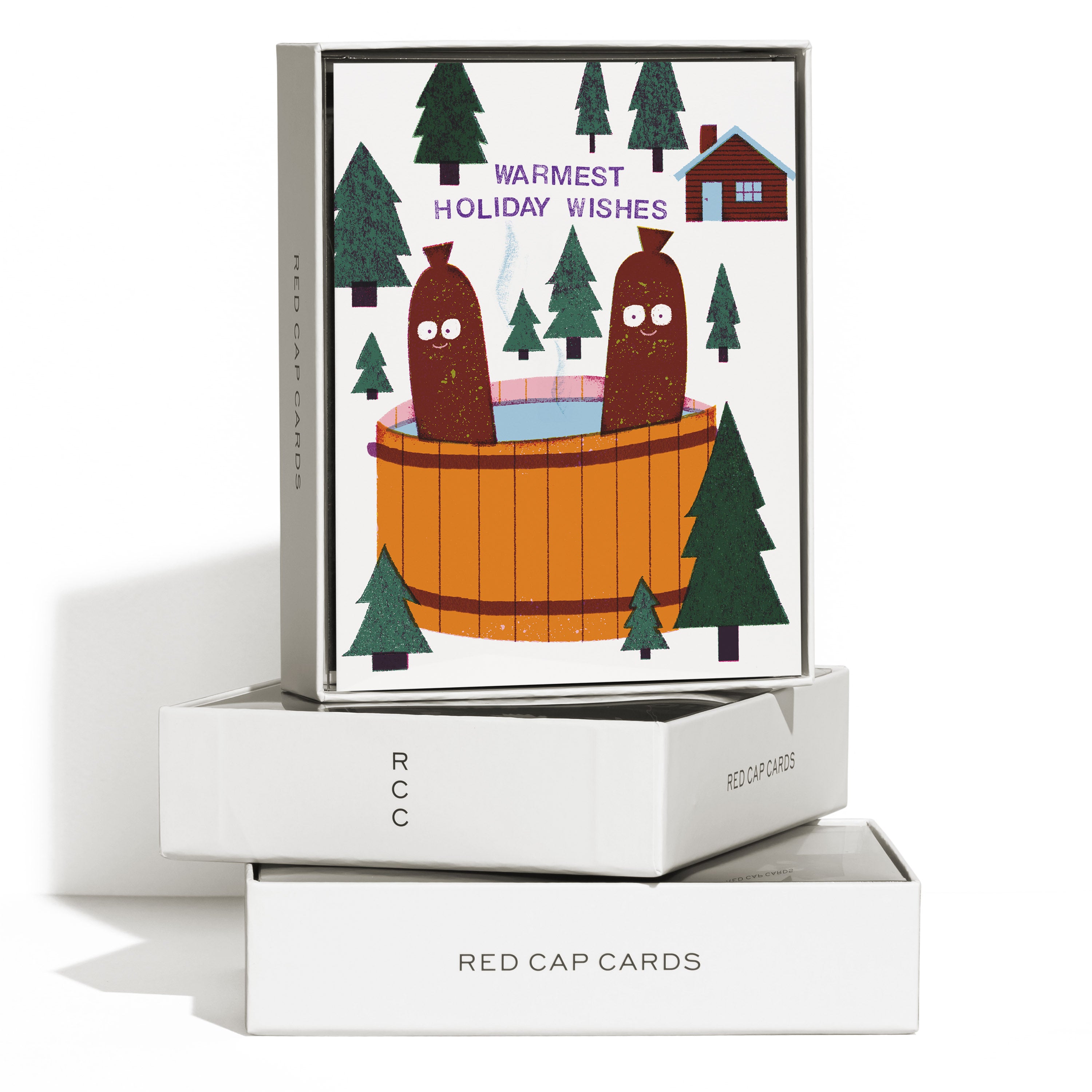 Boxed set of 8 "Warmest Holiday Wishes" card with two cartoon sausages sitting in a hot tub in a snowy wooded forest background.