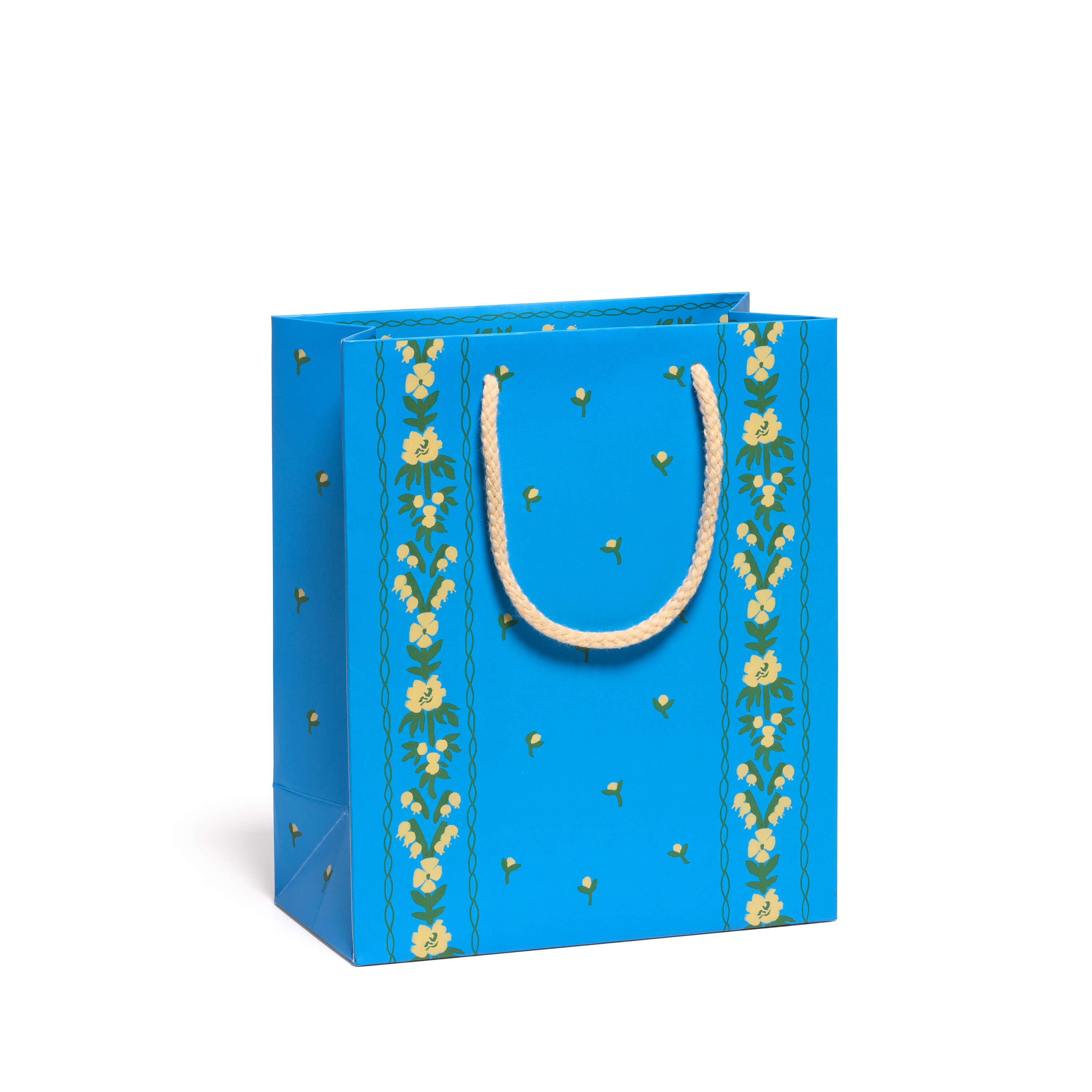Blue gift bag with floral patterns and a tan rope handle on a white background.