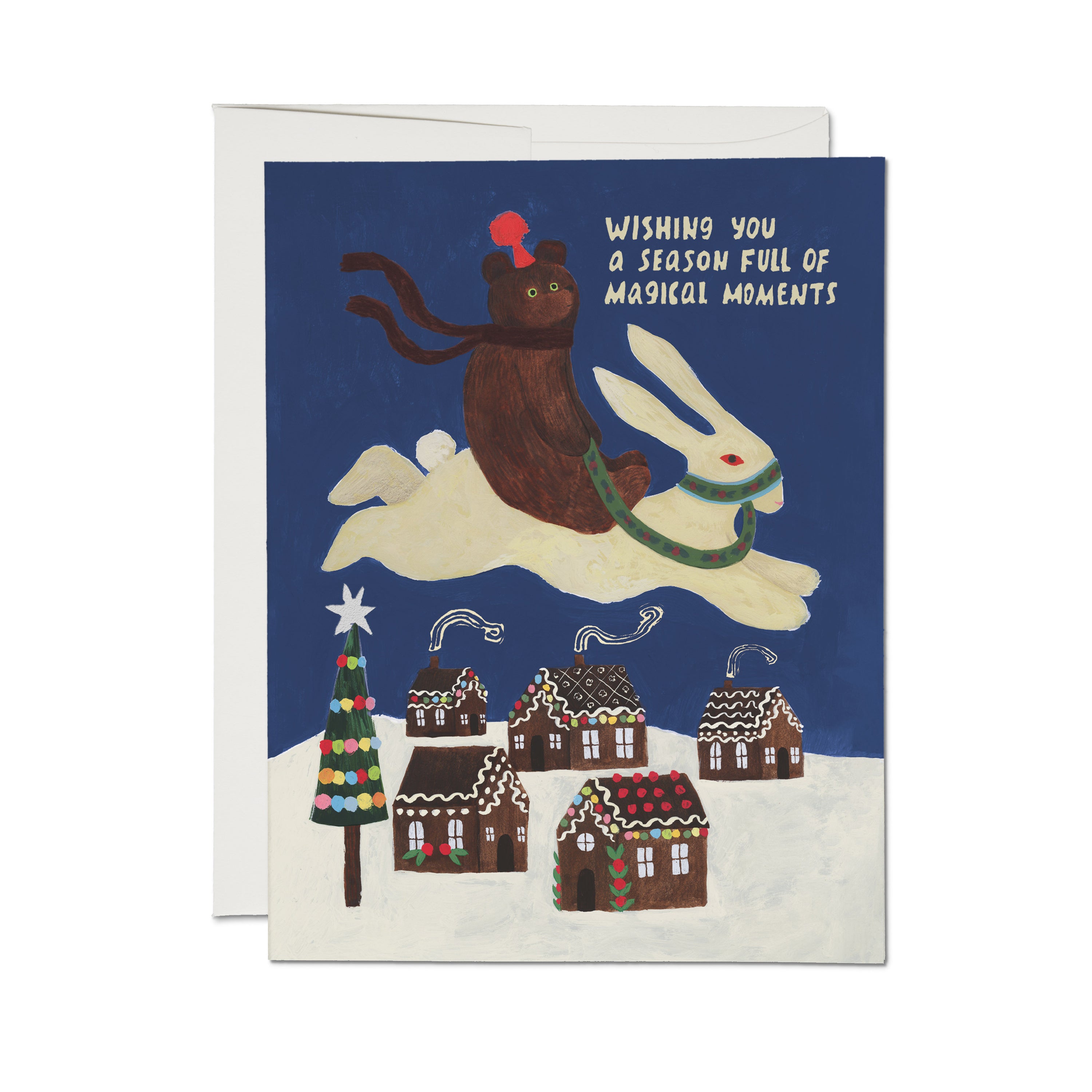 Christmas card with a cartoon bear riding a bunny over a snowy gingerbread house town and thoughtful words on a blue background.