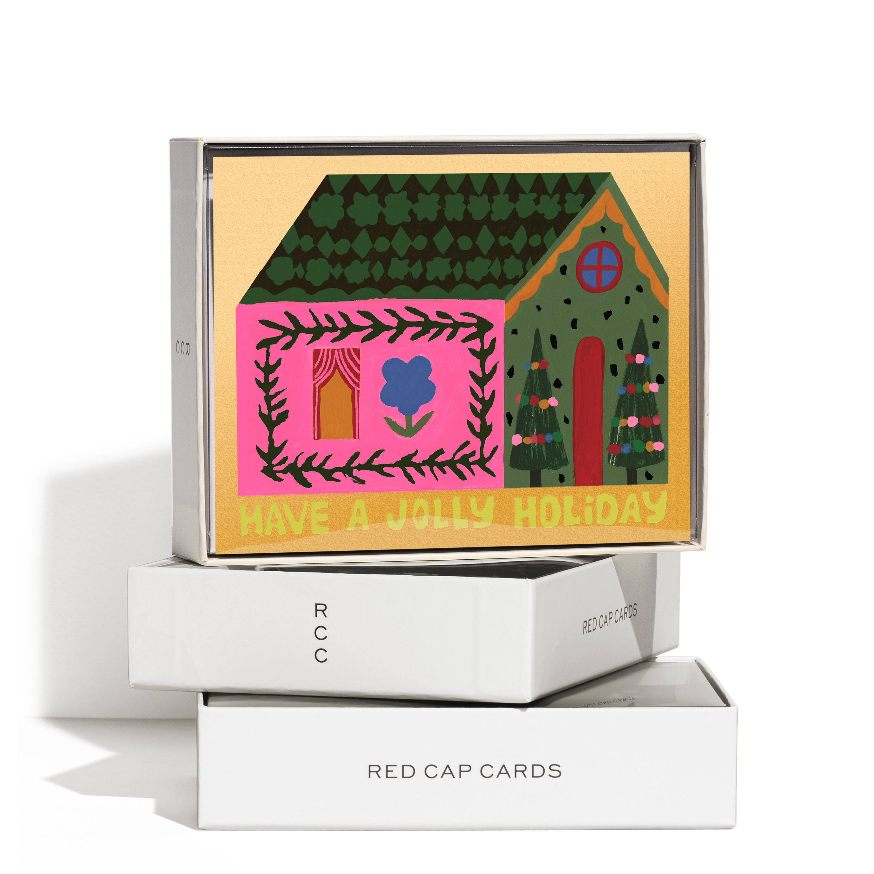 Boxed set of 8 Christmas cards with colorful decorated house and "Have a Jolly Holiday" text on yellow background.