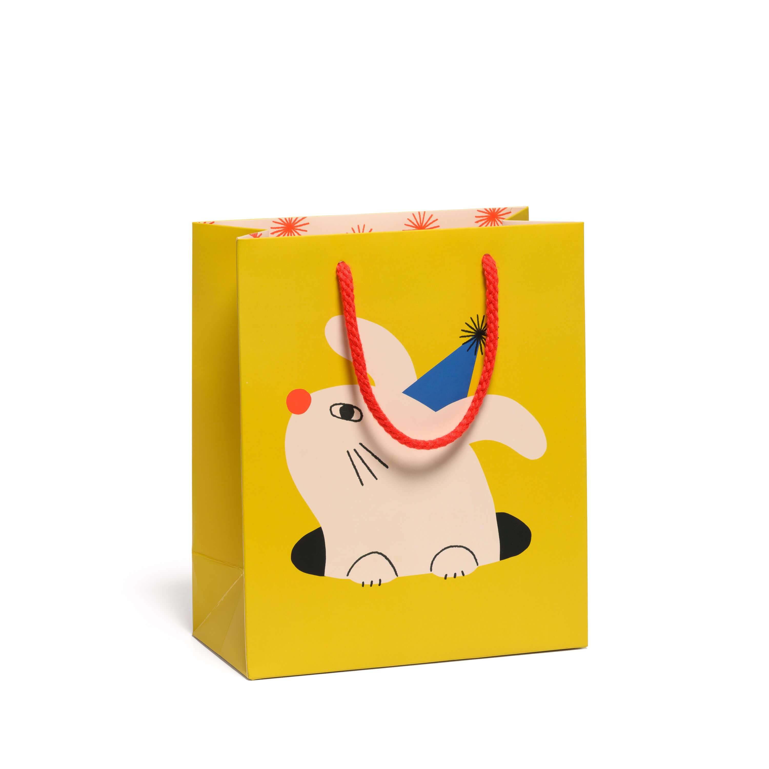 Medium Yellow gift bag with a cartoon rabbit with party hat design with a red rope handle on a white background.