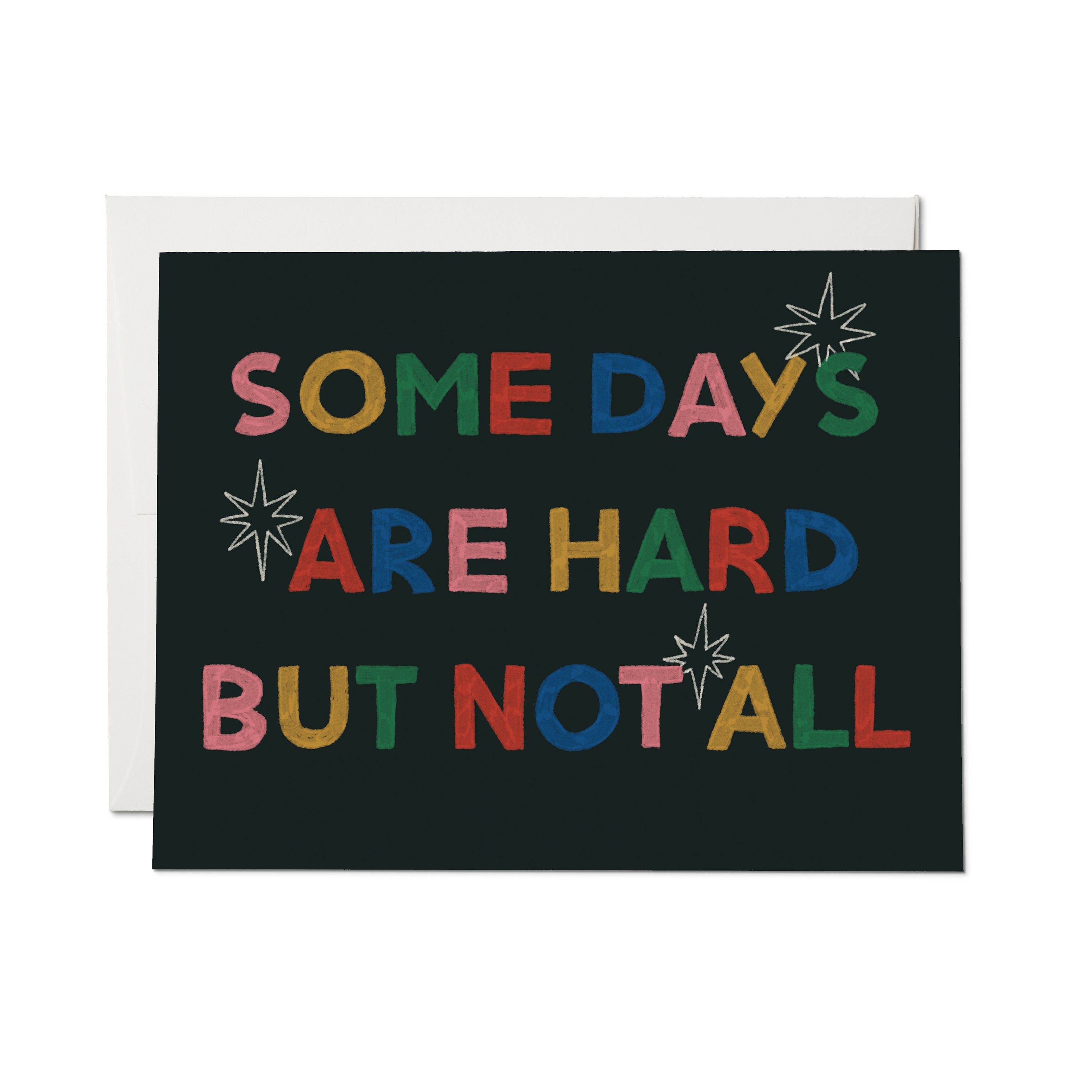 Greeting card with stars and colorful "SOME DAYS ARE HARD BUT NOT ALL" text on black background.