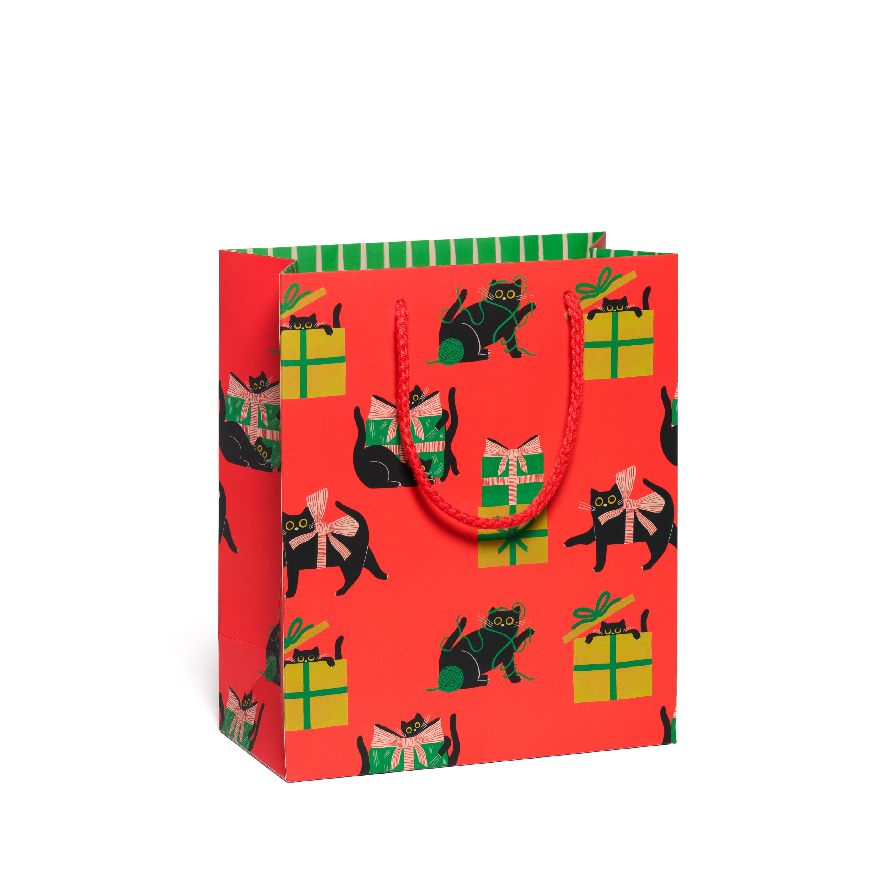 Red gift bag with black cats and presents, bow and yarn pattern on a red background and green stripe interior.