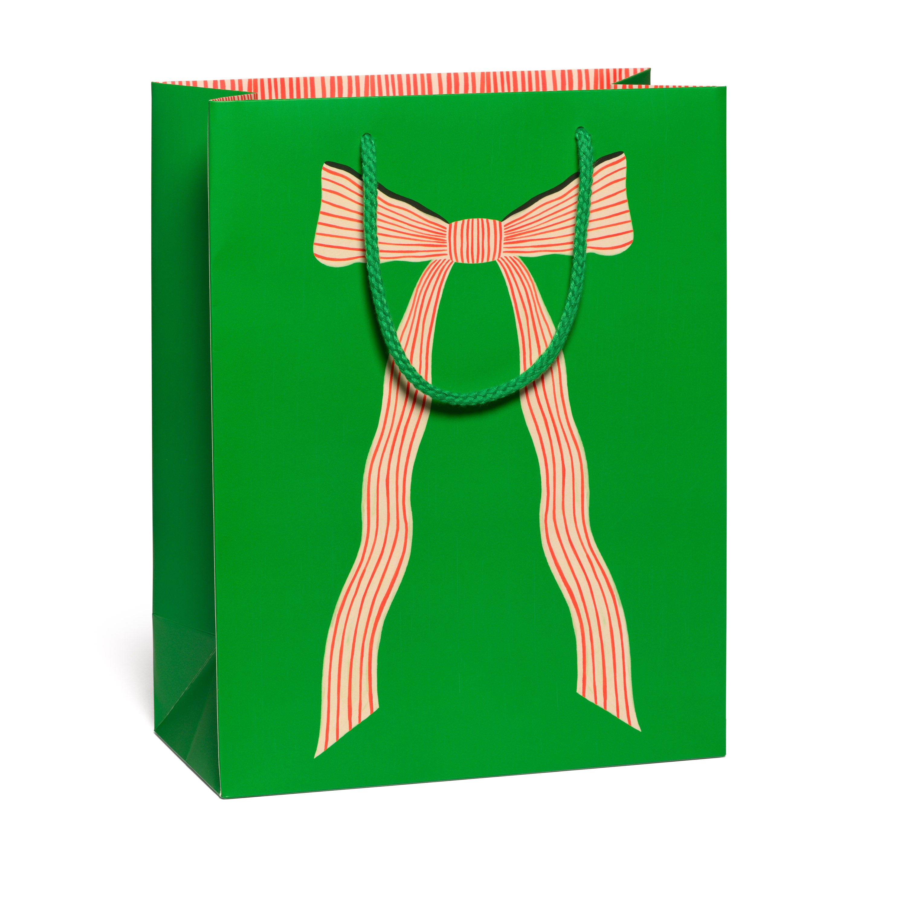 Large green holiday gift bag with a candy cane striped bow design and a green rope handle.