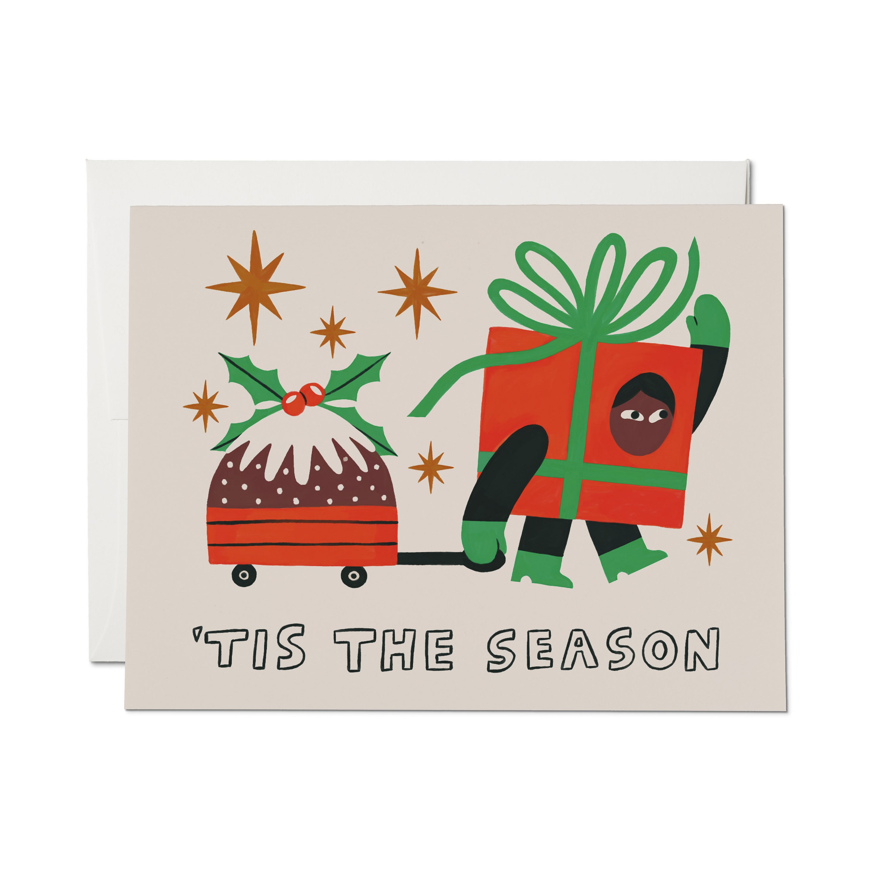 Christmas Card with cartoon person in a gift box costume pulling a pudding in a wagon with "'Tis the Season" text.