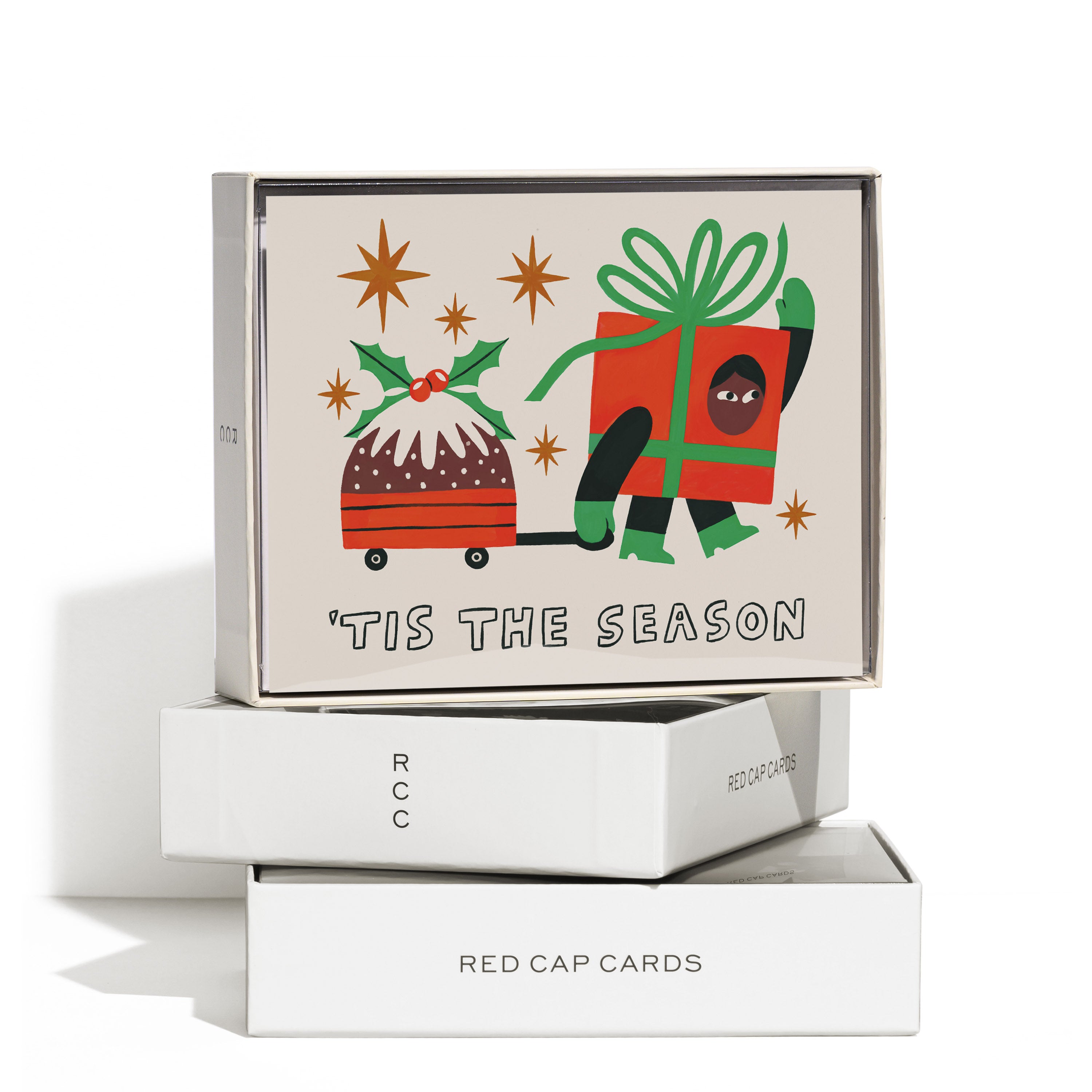 Boxed set of 8 Christmas Card with cartoon person in a gift box costume pulling a pudding in a wagon with "'Tis the Season" text.