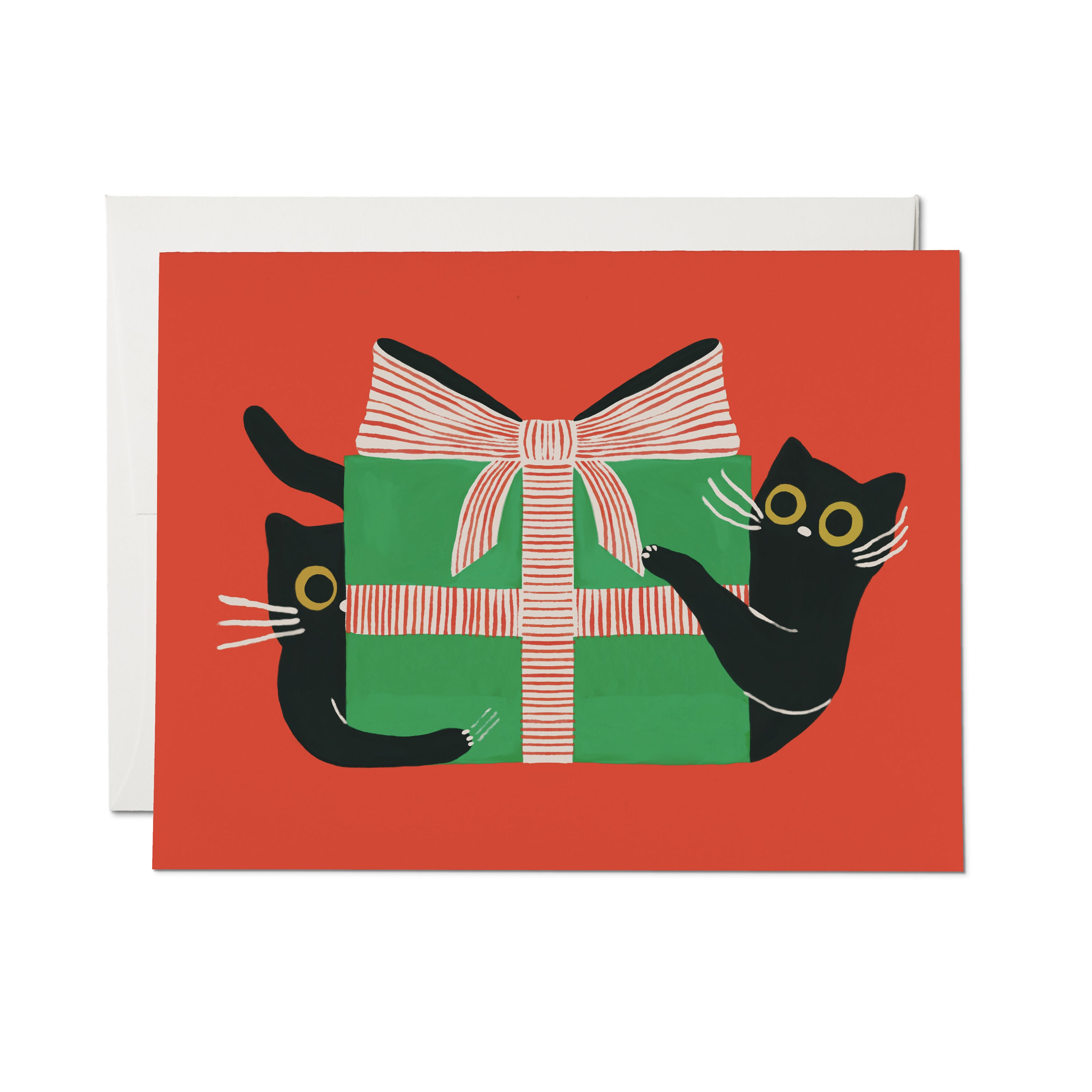 Greeting card with red background featuring black cats on each side of a green gift box with a pink and white striped bow. 