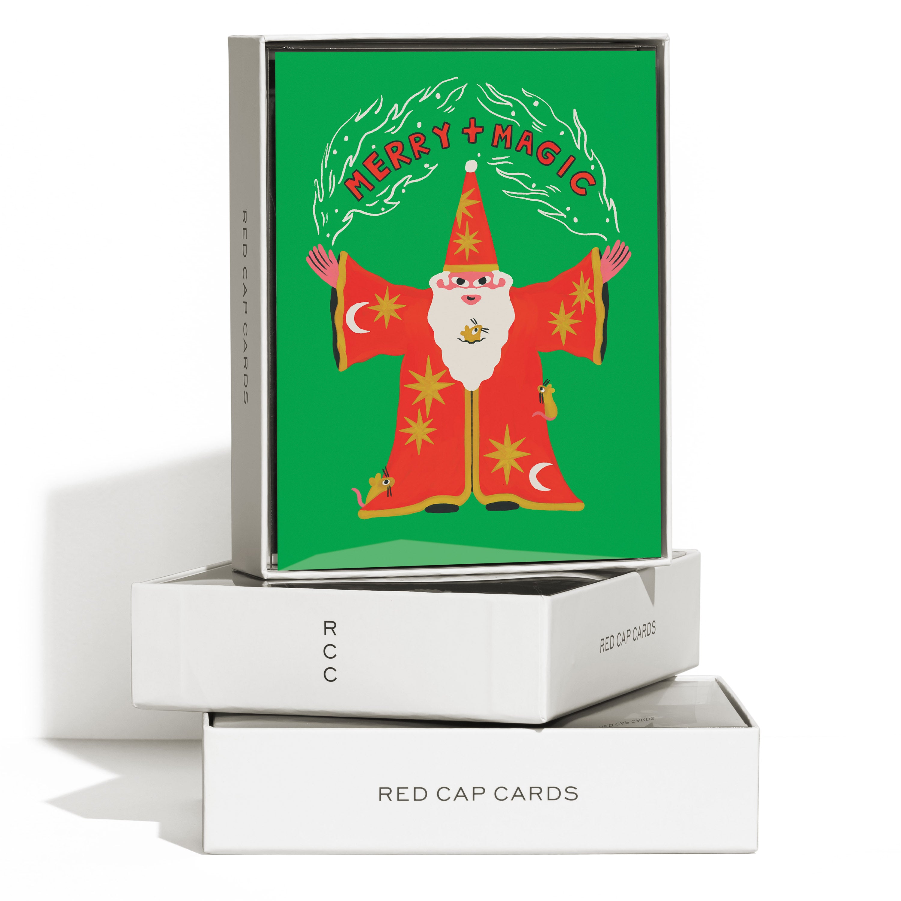 Boxed set of 8 Christmas cards with a Santa - Wizard hybrid casting a 'Merry + Magic' spell  on a green background.