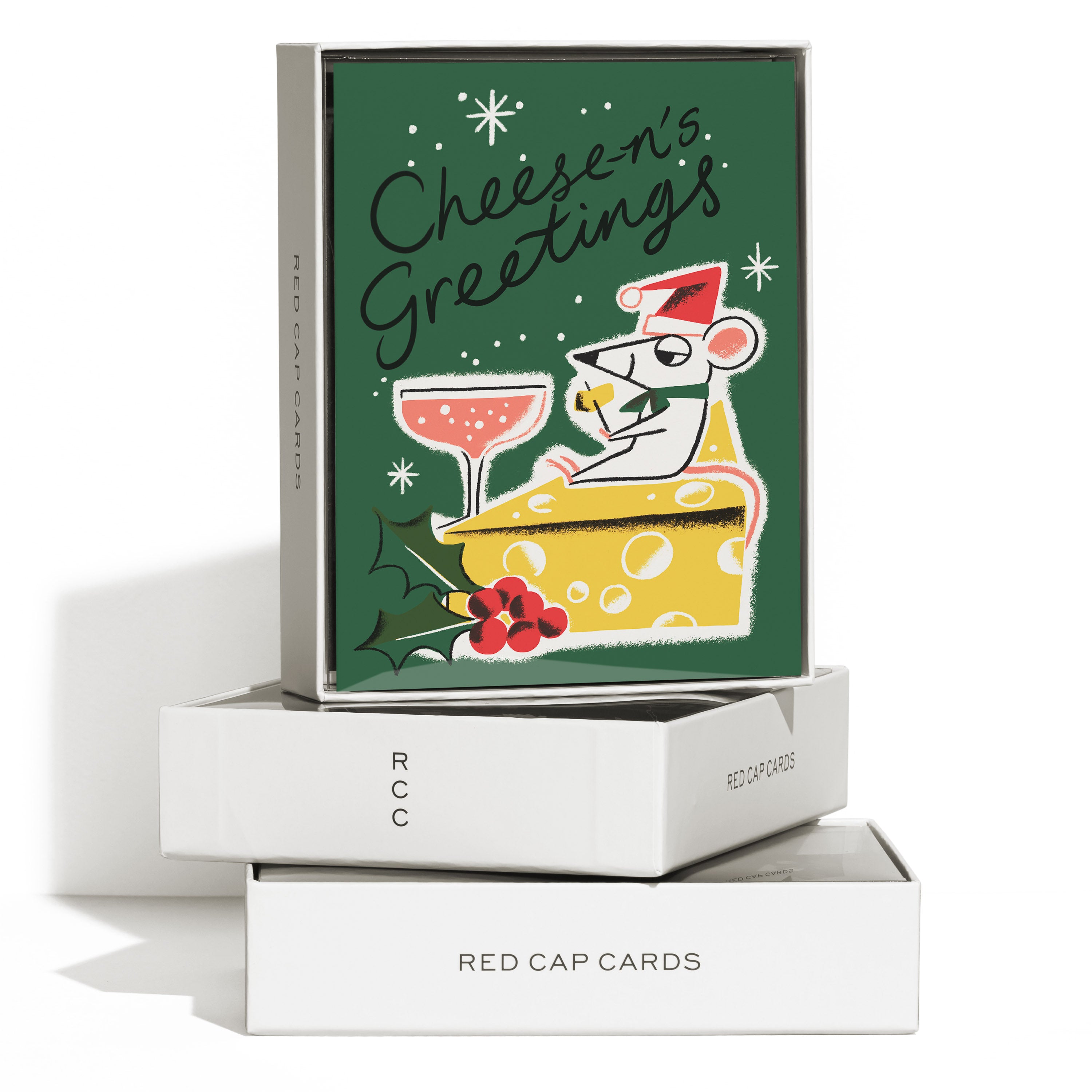 Boxed set of 8 Christmas cards, cartoon mouse on cheese slice, pink cocktail, 'Cheese-n's Greetings' text, green background.
