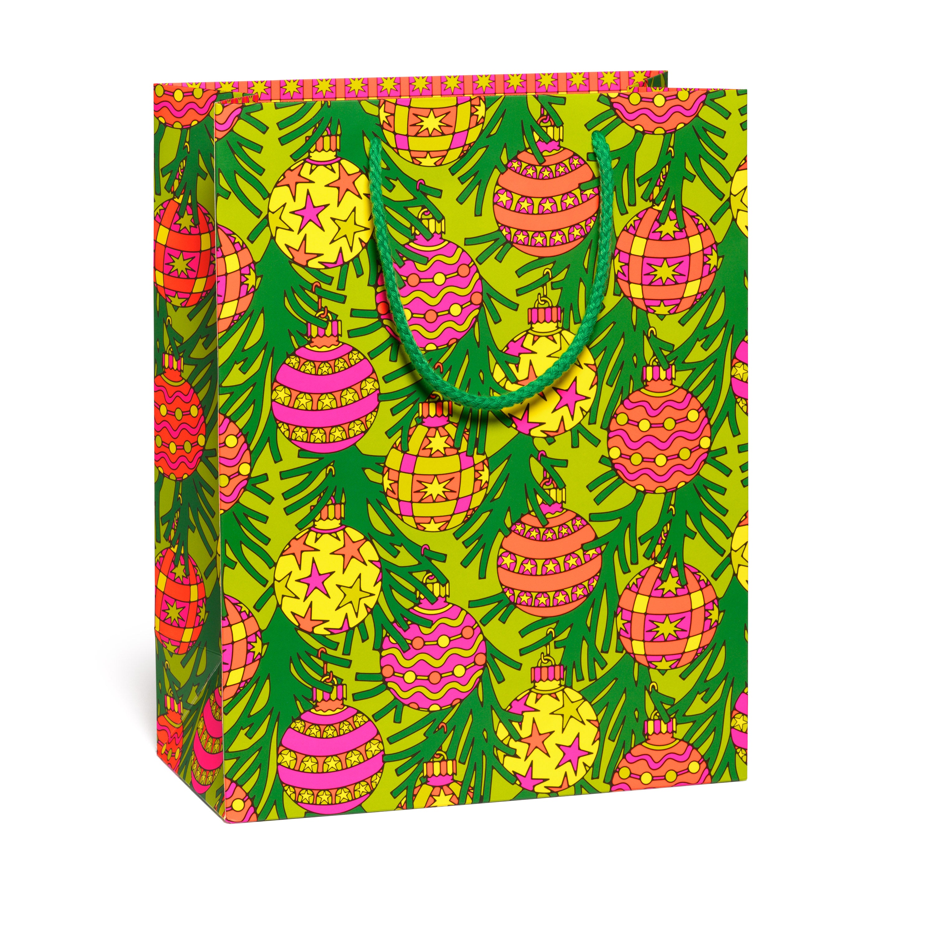 Colorful gift bag with Christmas tree  and ornaments pattern on a white background.