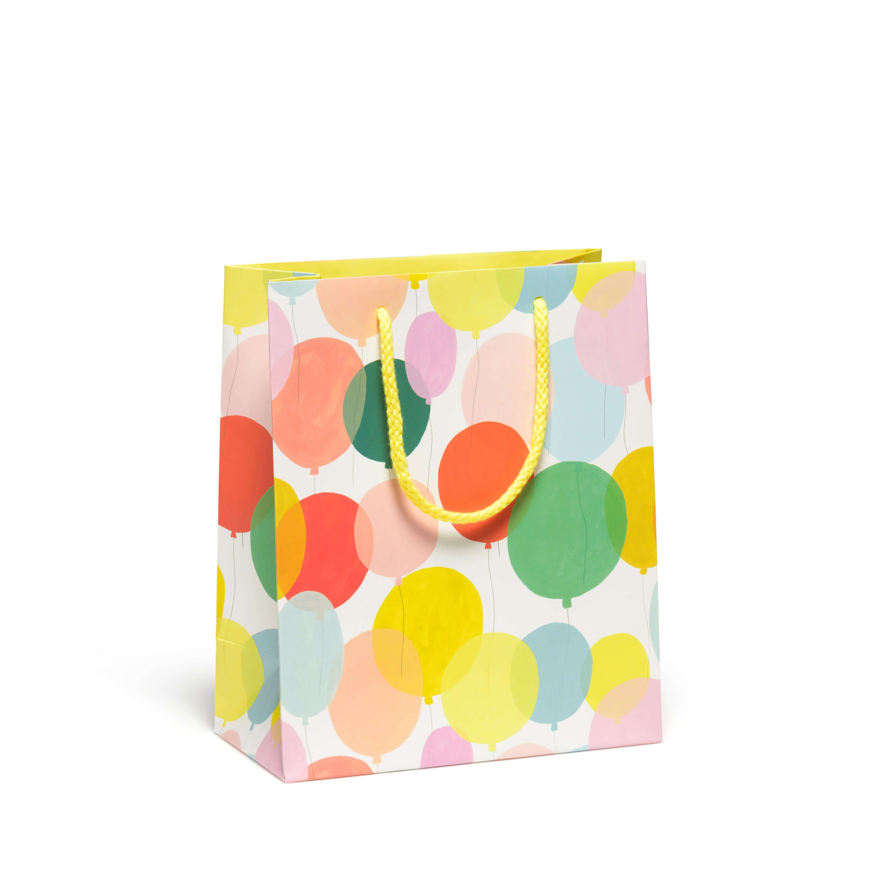 Medium gift bag with a colorful balloon pattern and a yellow rope handle on a white background.