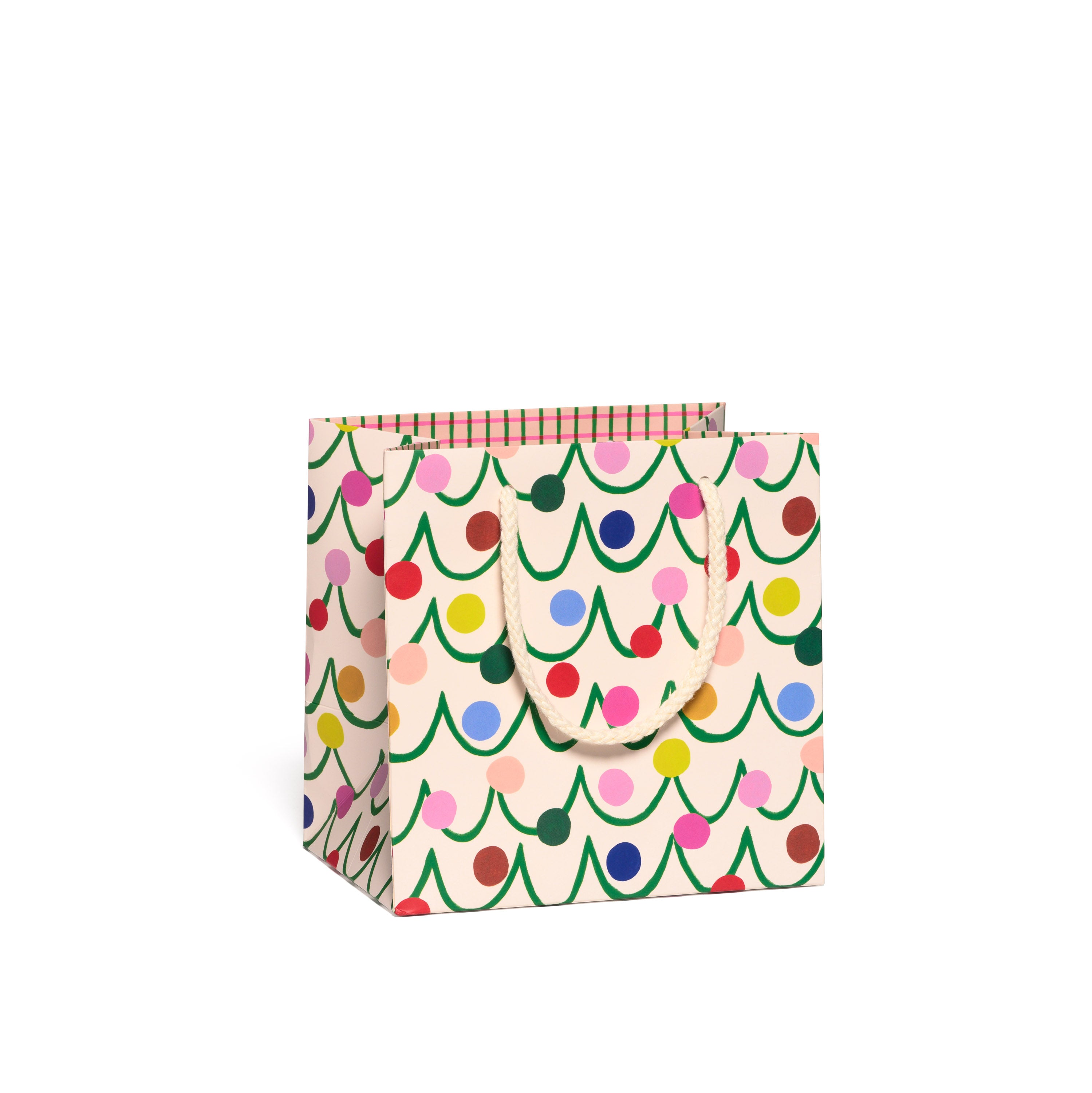 Small Gift bag with colorful Christmas tree pattern on a white background.