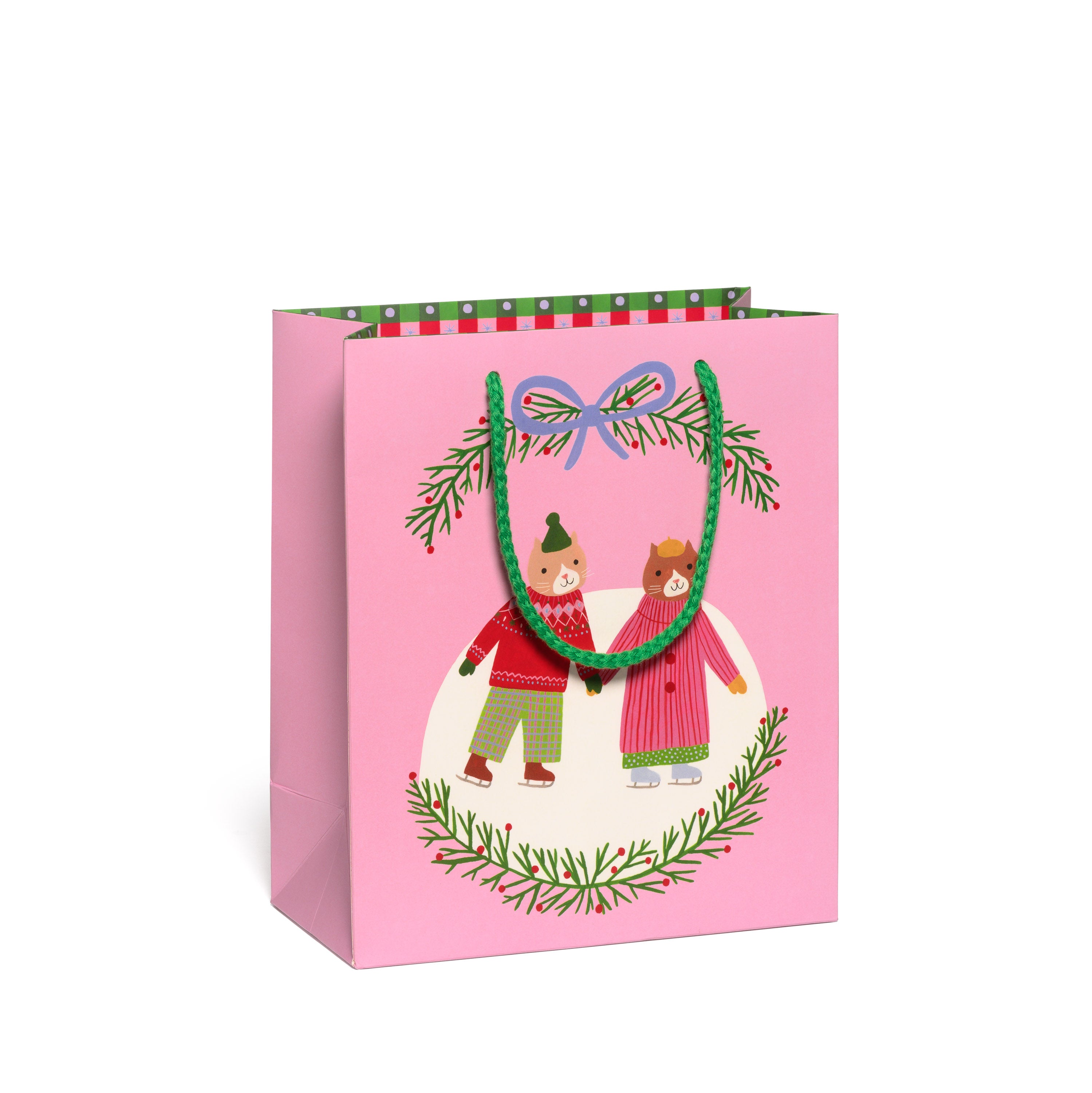 Pink gift bag with Christmas-themed design featuring two cats holding hands ice skating with a green rope.