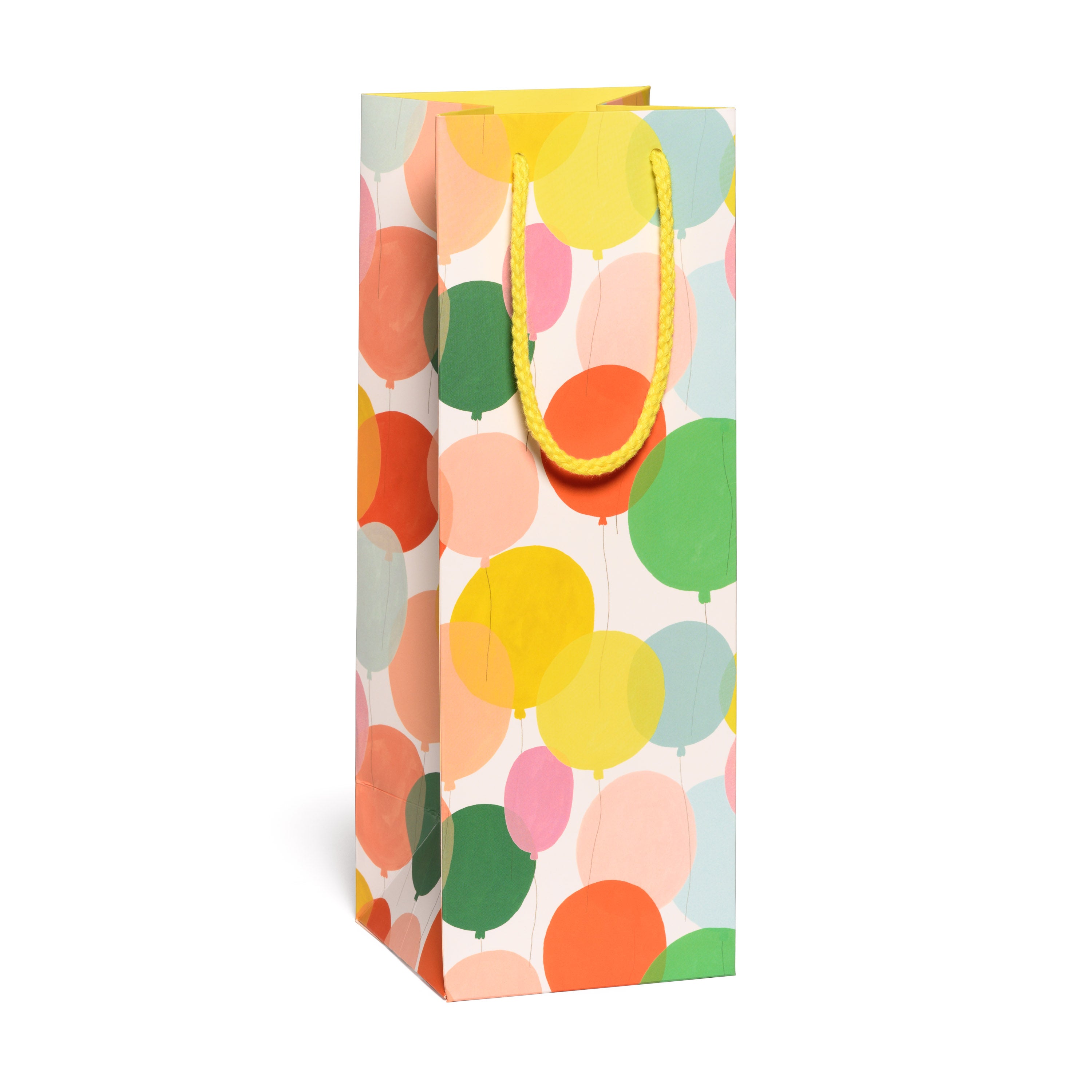 Colorful gift bag with balloon pattern on a white background.