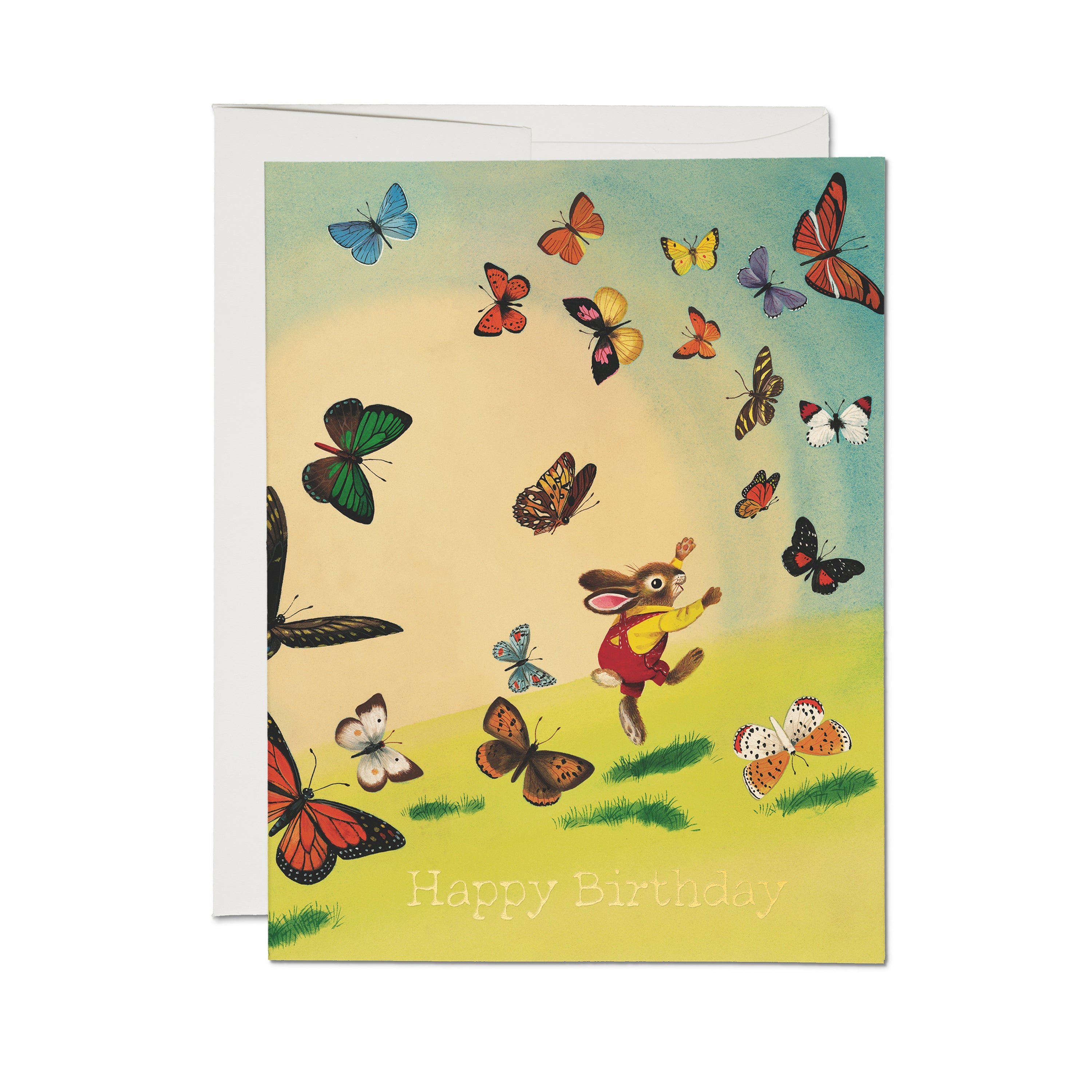 Birthday card with cartoon bunny in a grassy field surrounded by colorful butterflies.