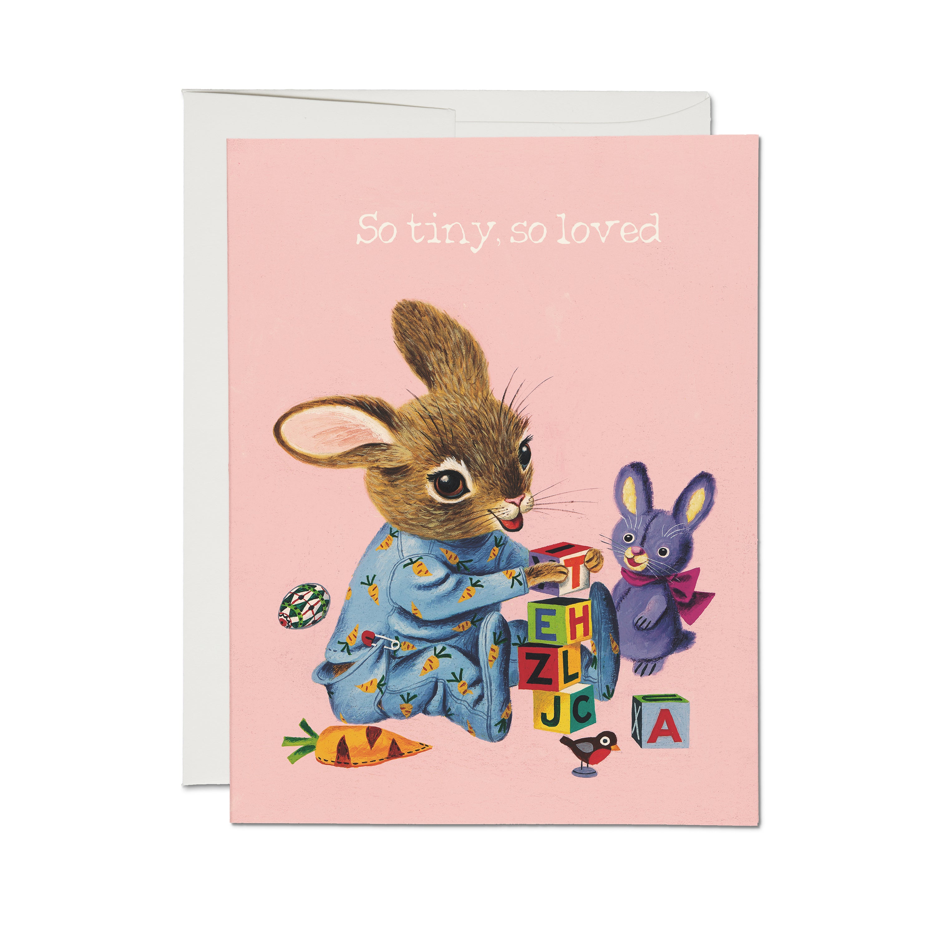 New baby greeting card with illustrated bunny playing with toys and "So tiny, so loved" white text on pink background.