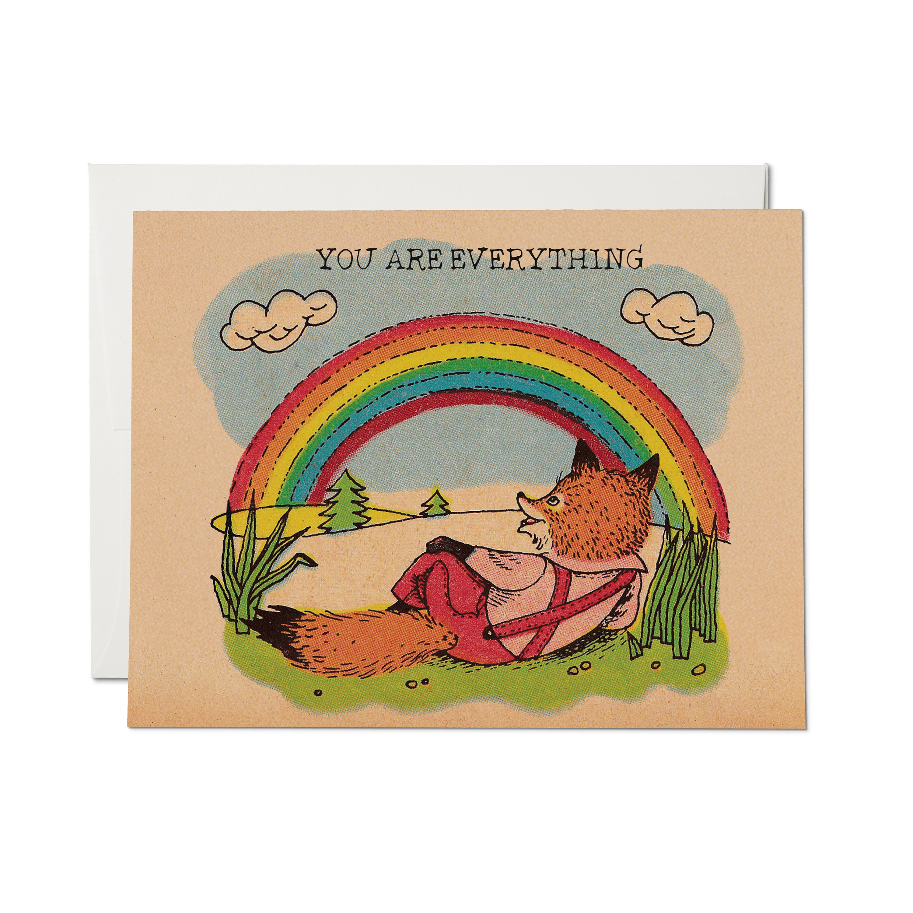 Greeting card with a cartoon fox lying in a field gazing at a rainbow, with 'You Are Everything' text.