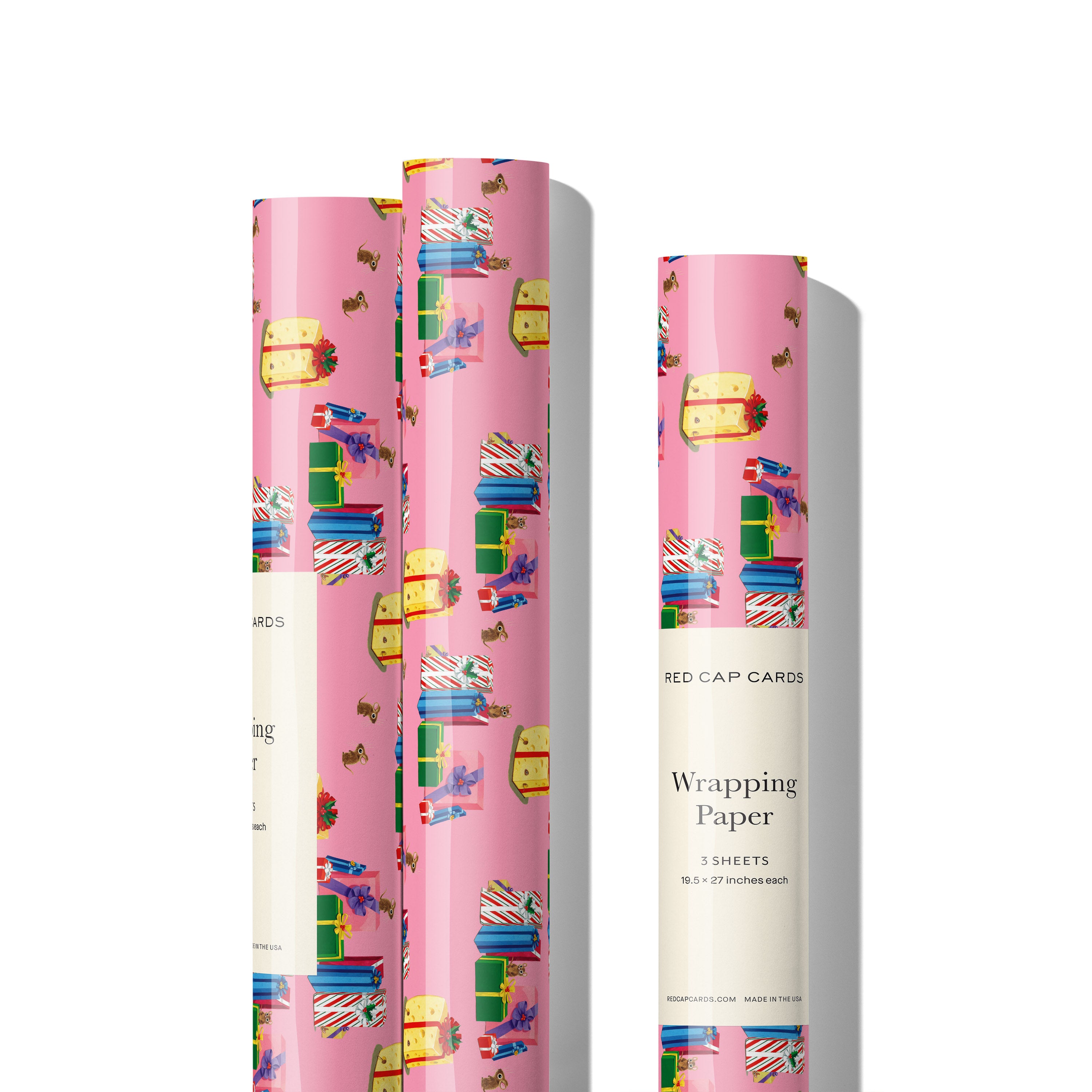 Three rolls of Pink gift wrap with pattern of illustrated presents and ribbon and tied with a bright pink bow on a white background.