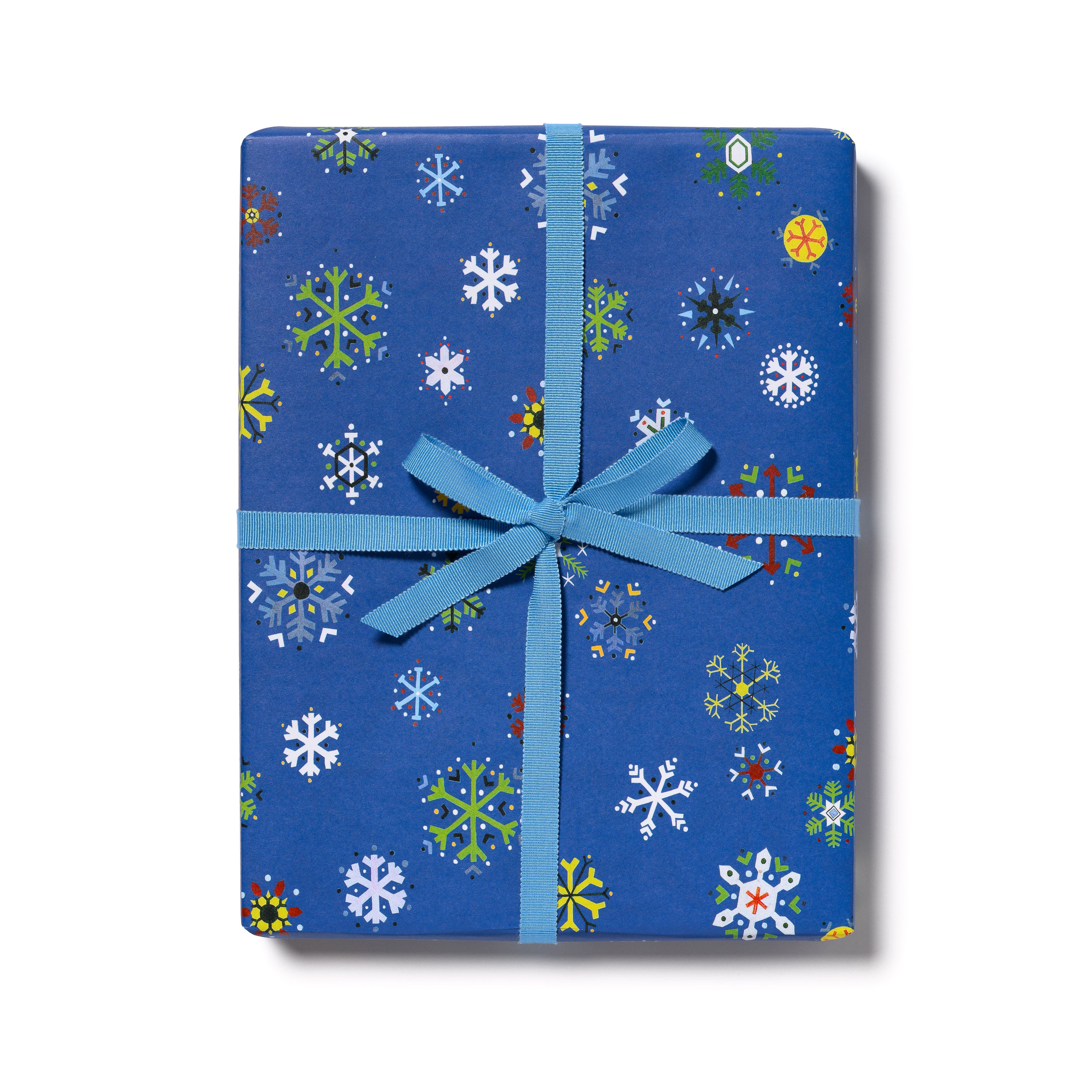Blue wrapping paper with illustrated colorful snowflake design and blue ribbon on white background.
