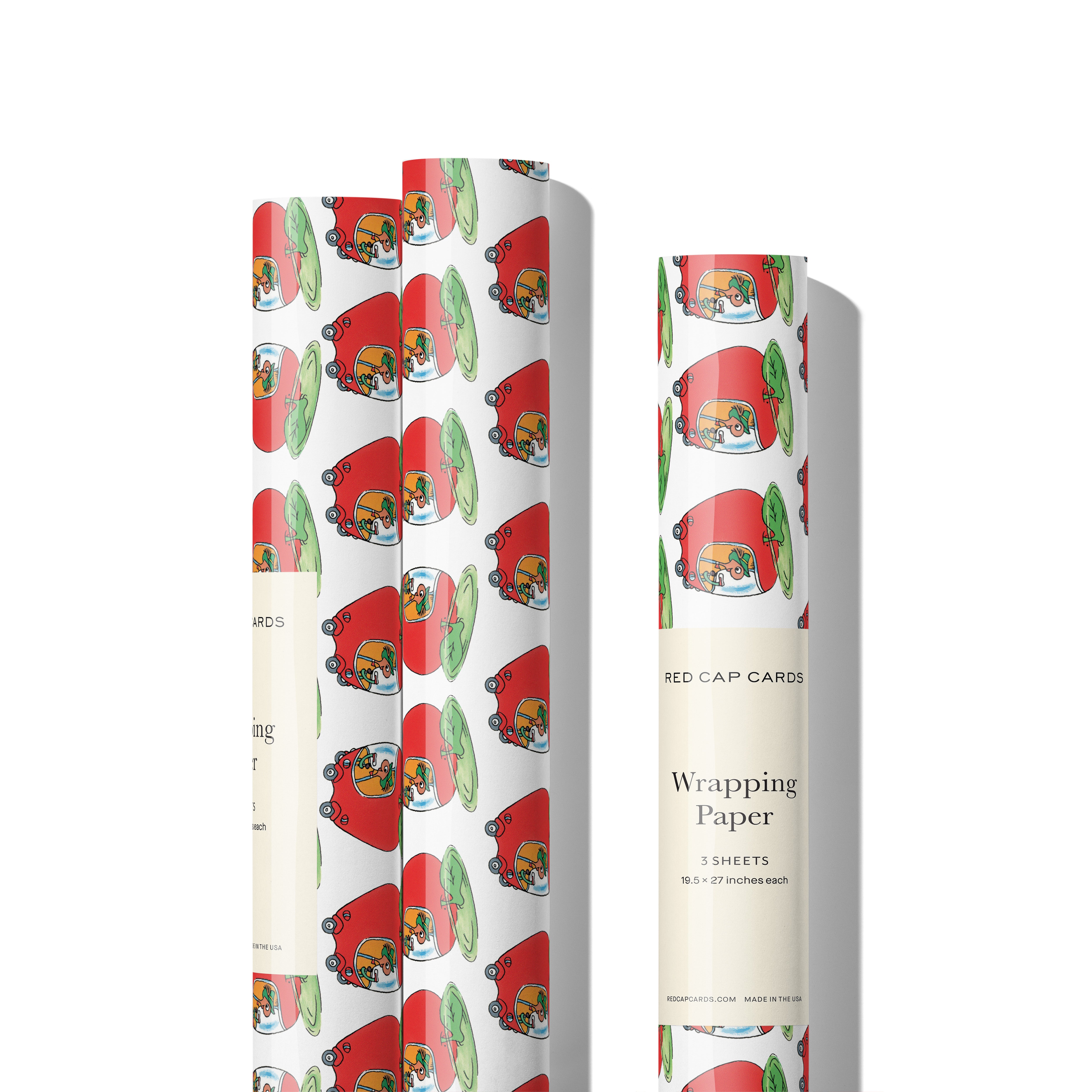 Three rolls of gift wrap with patter of the Lowly Worm in an apple car on white background. 