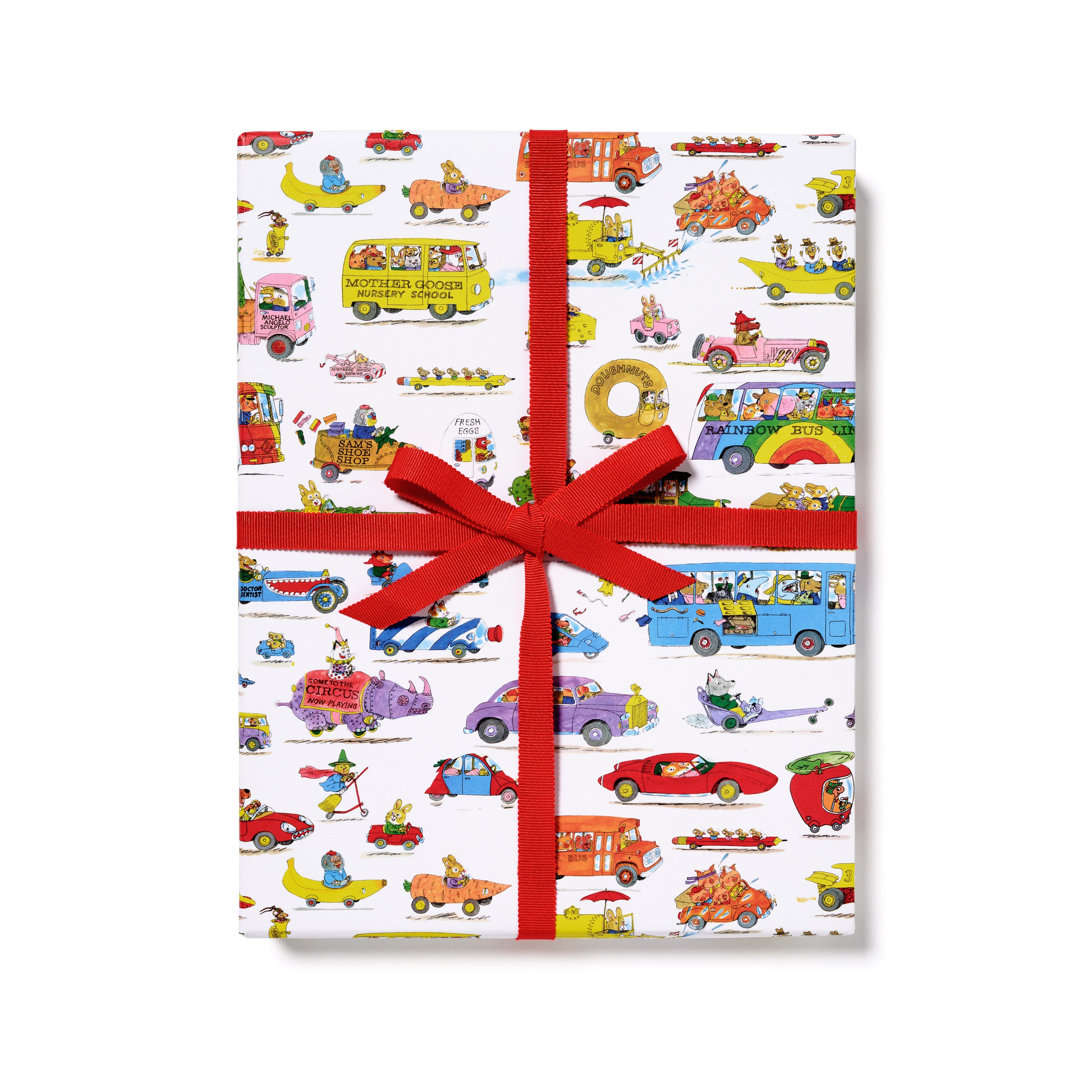 Gift wrap with colorful Busytown themed vehicle pattern and red ribbon on a white background.