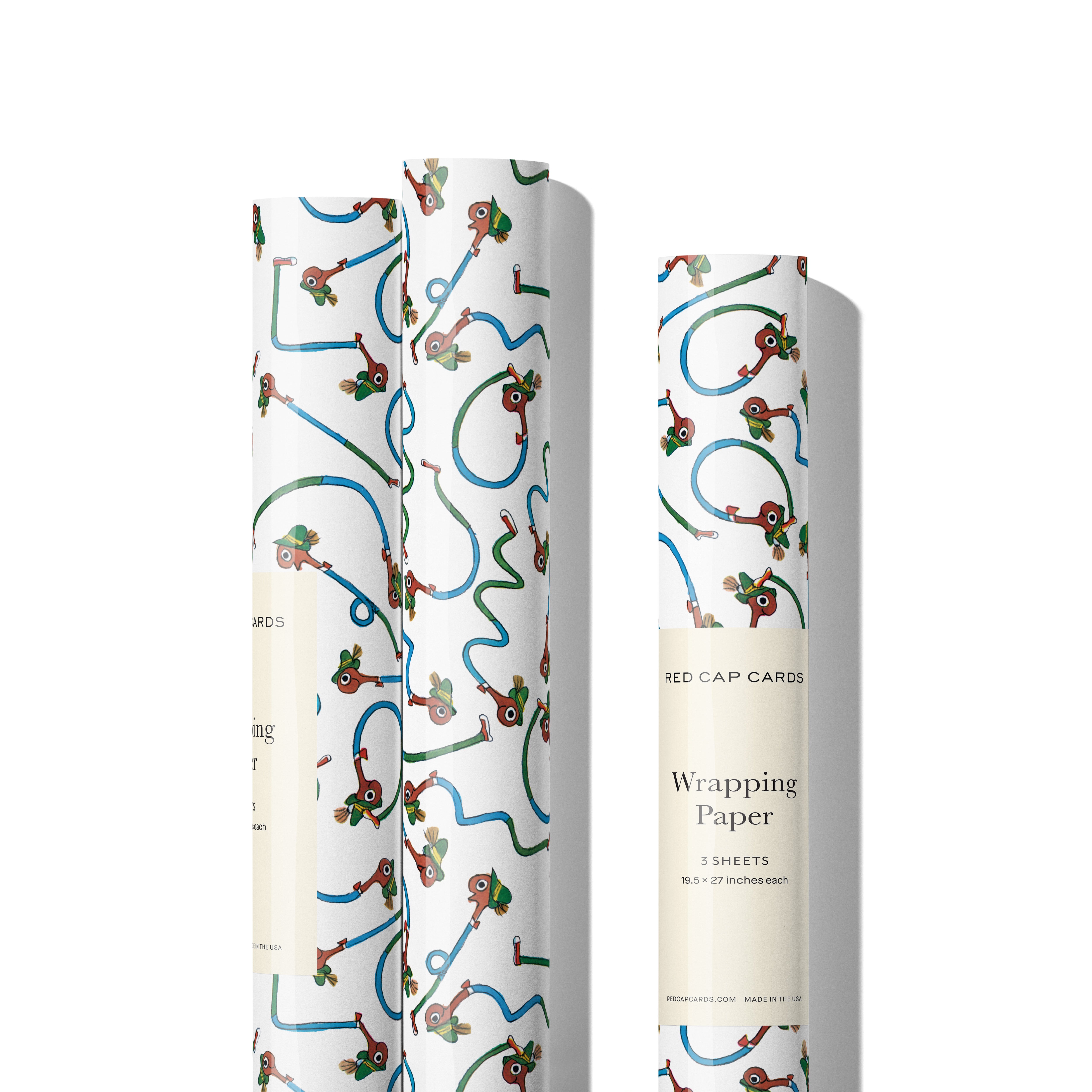 Three rolls of gift wrap featuring Richard Scarry's Lowly Worm print on white background.