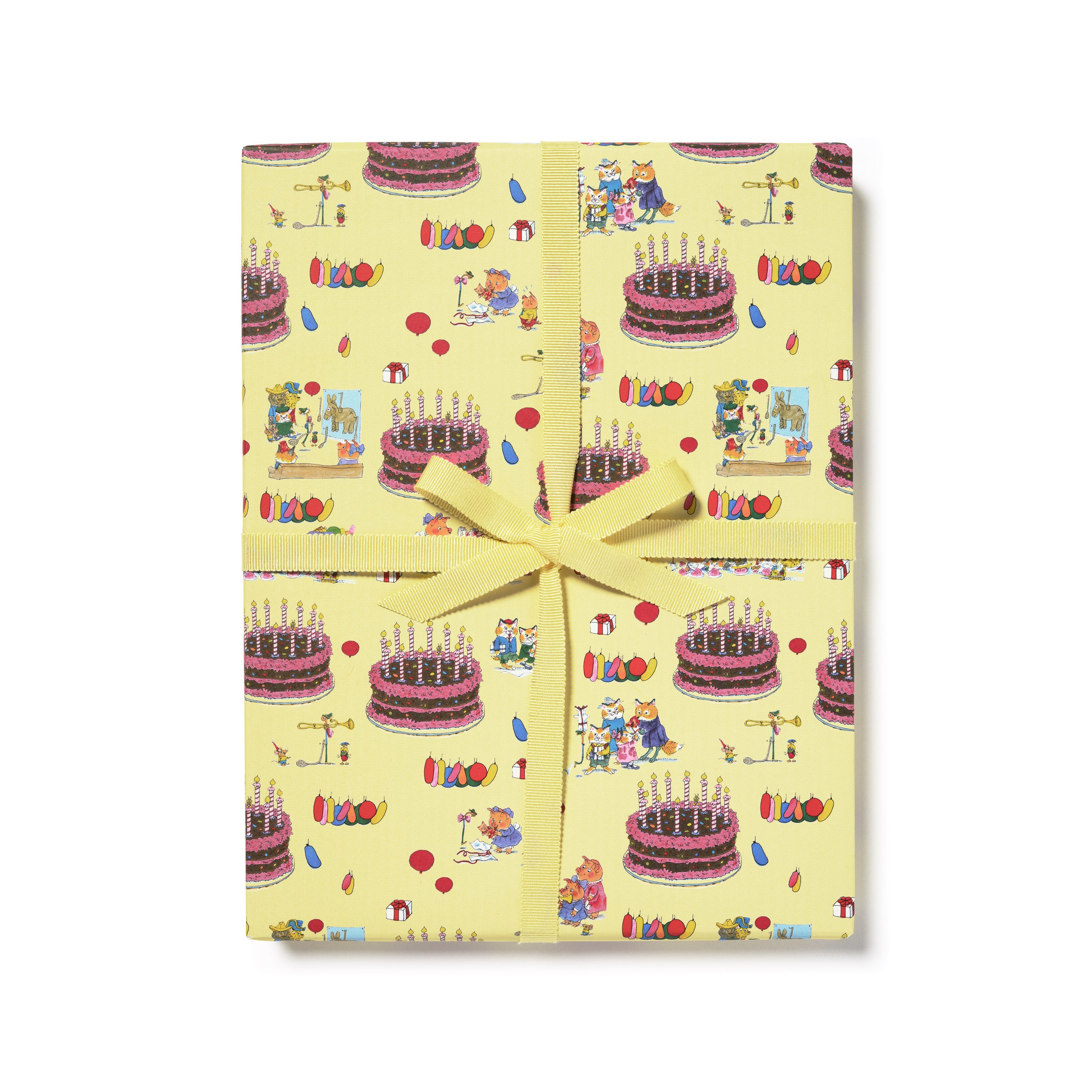Gift wrap with animal illustrations and party themes with a giant cake on a yellow background. 