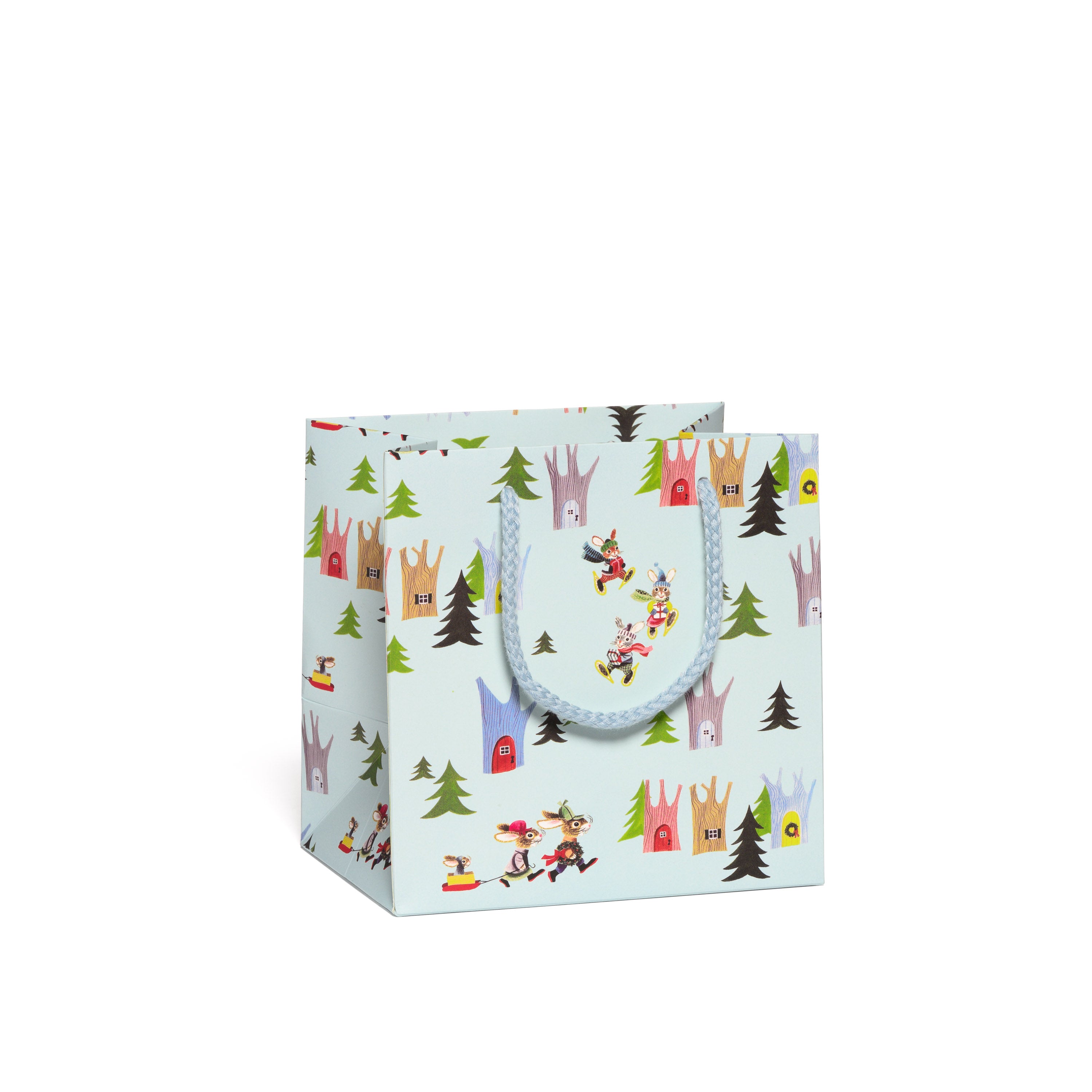 Gift bag with cartoon animal and tree pattern on a white background.