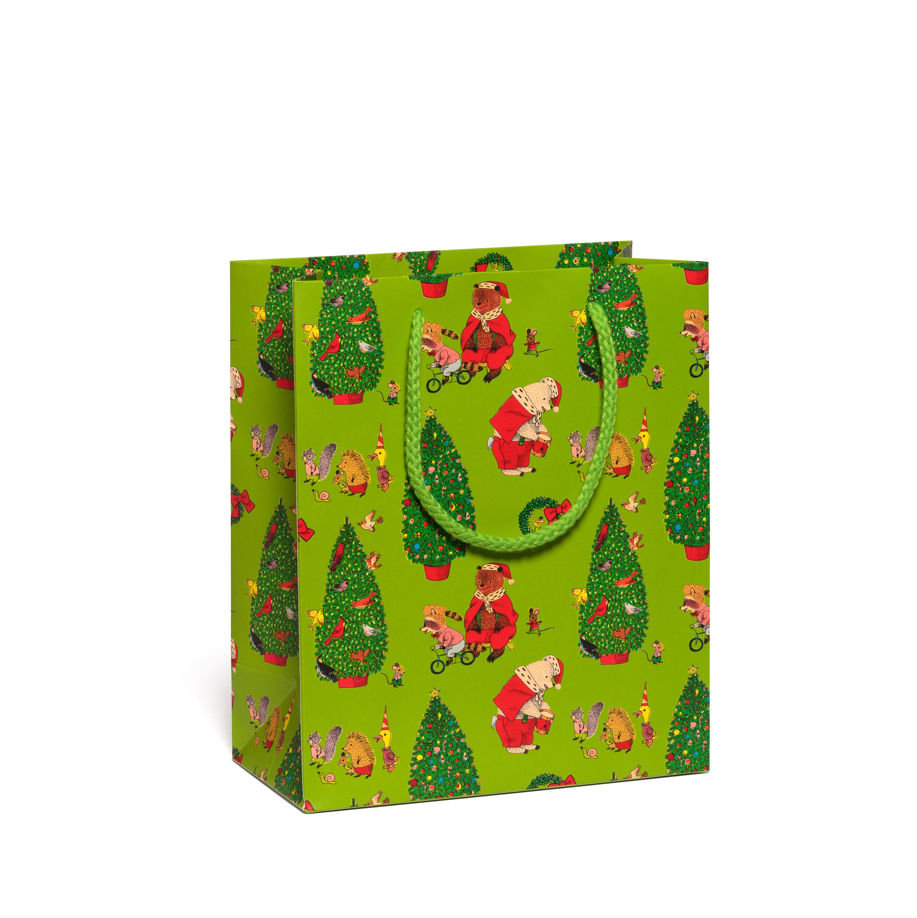 Green gift bag with festive design featuring trees and animal characters on a white background.