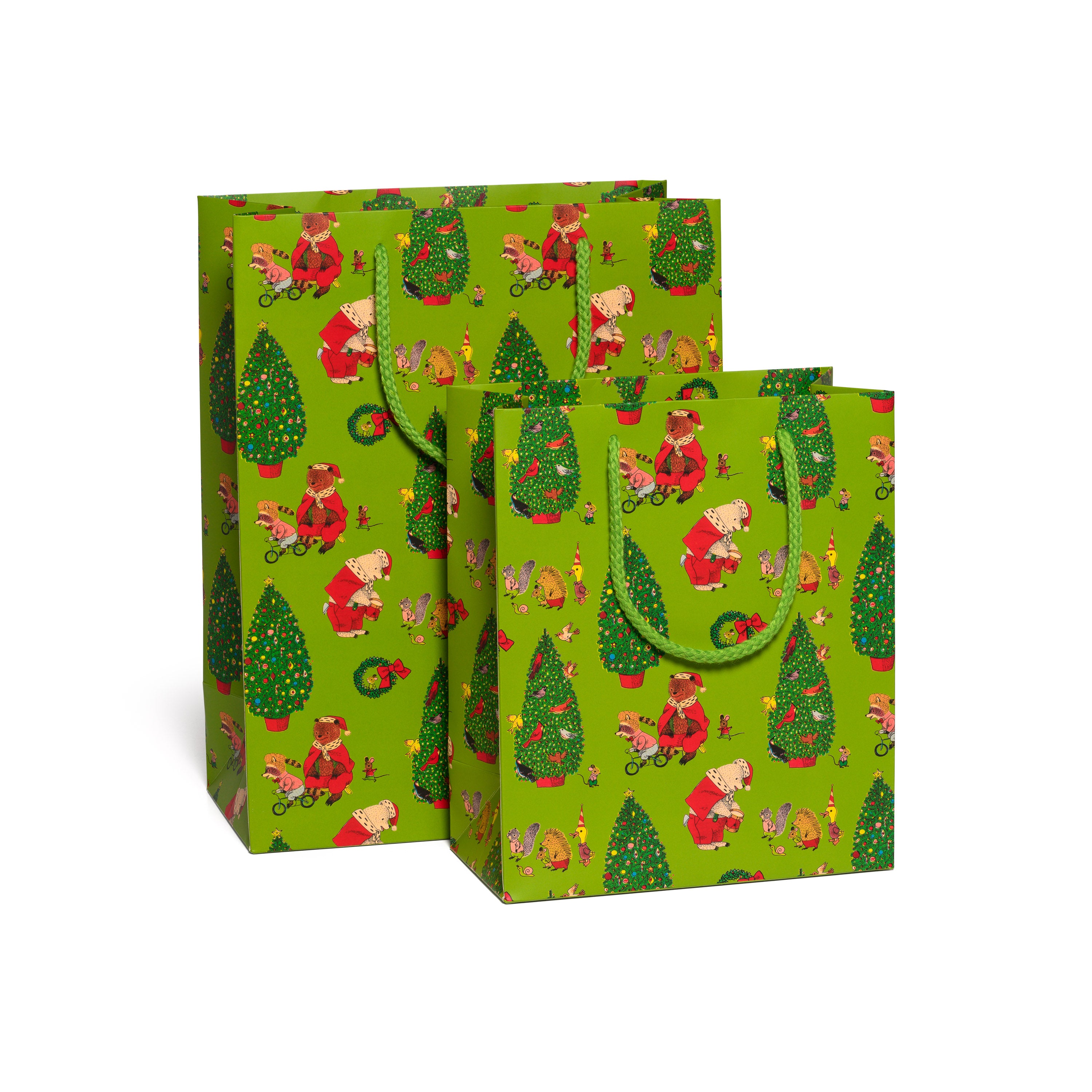 Two Holiday themed green gift bags with festive and animal designs on a green background.