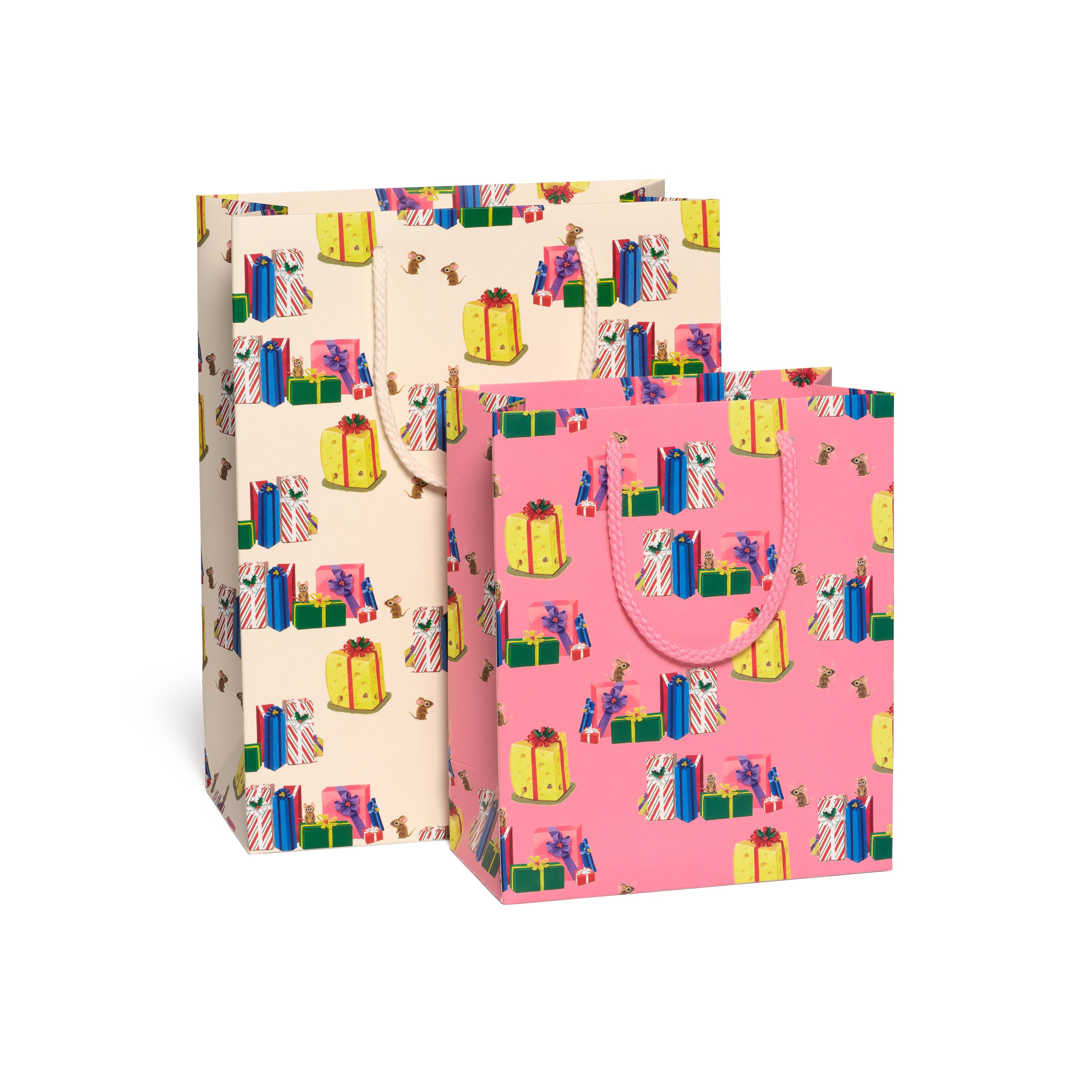 Two gift bags one tan one pink with colorful Christmas present patterns on a white background.