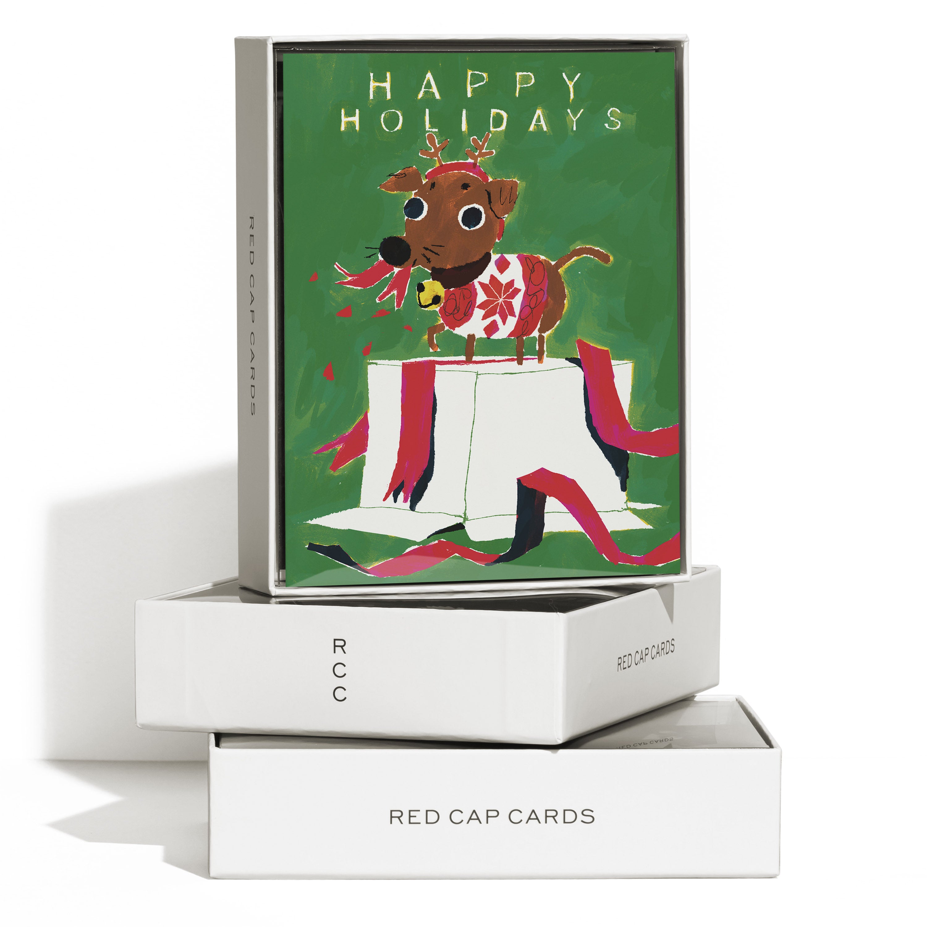Boxed set of 8 colorful Christmas cards with cartoon dog destroying a present with 'Happy Holidays' text. 