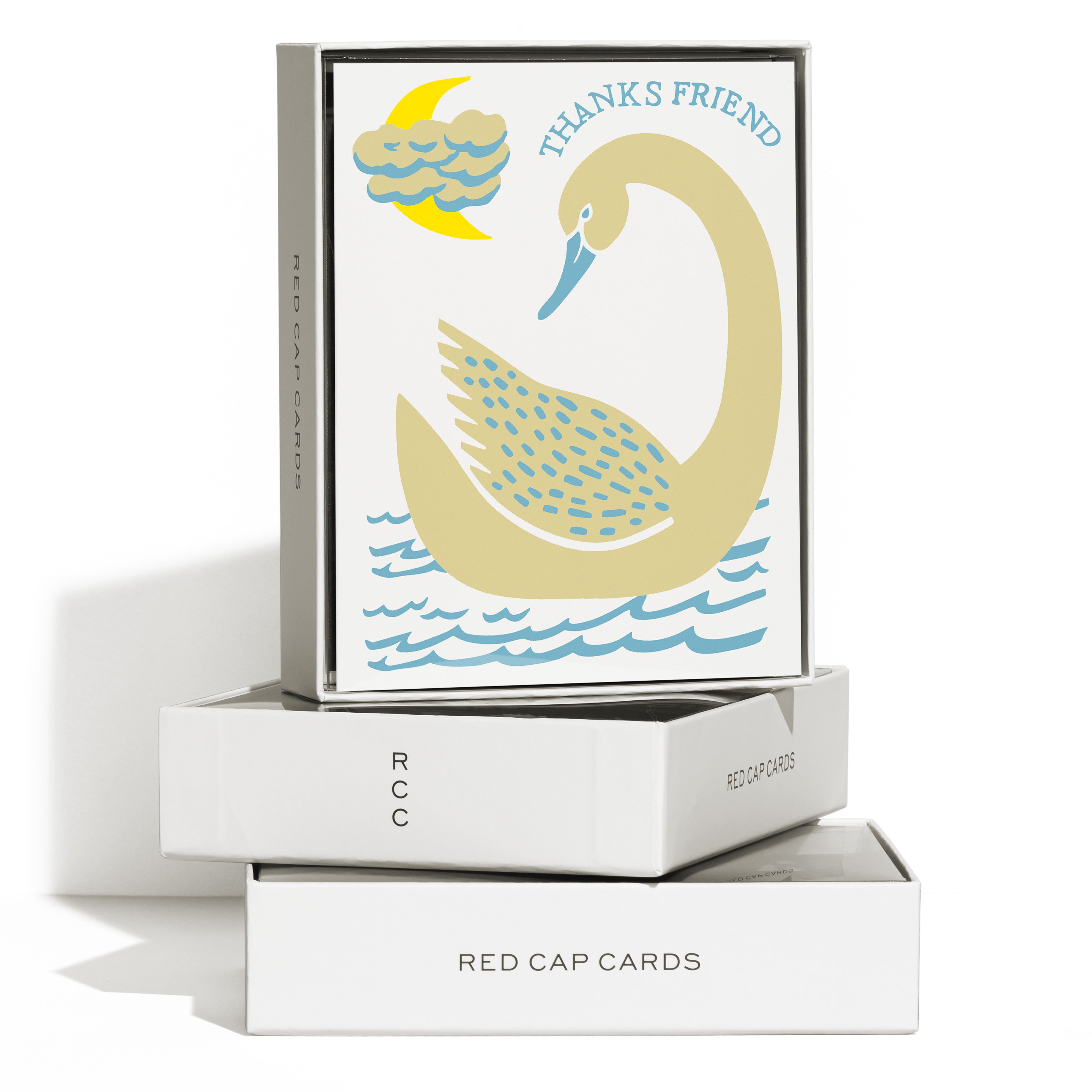 Boxed Set of 8 "Thanks Friend" cards with a gold swan on blue waves, crescent moon and cloud, on a white background.