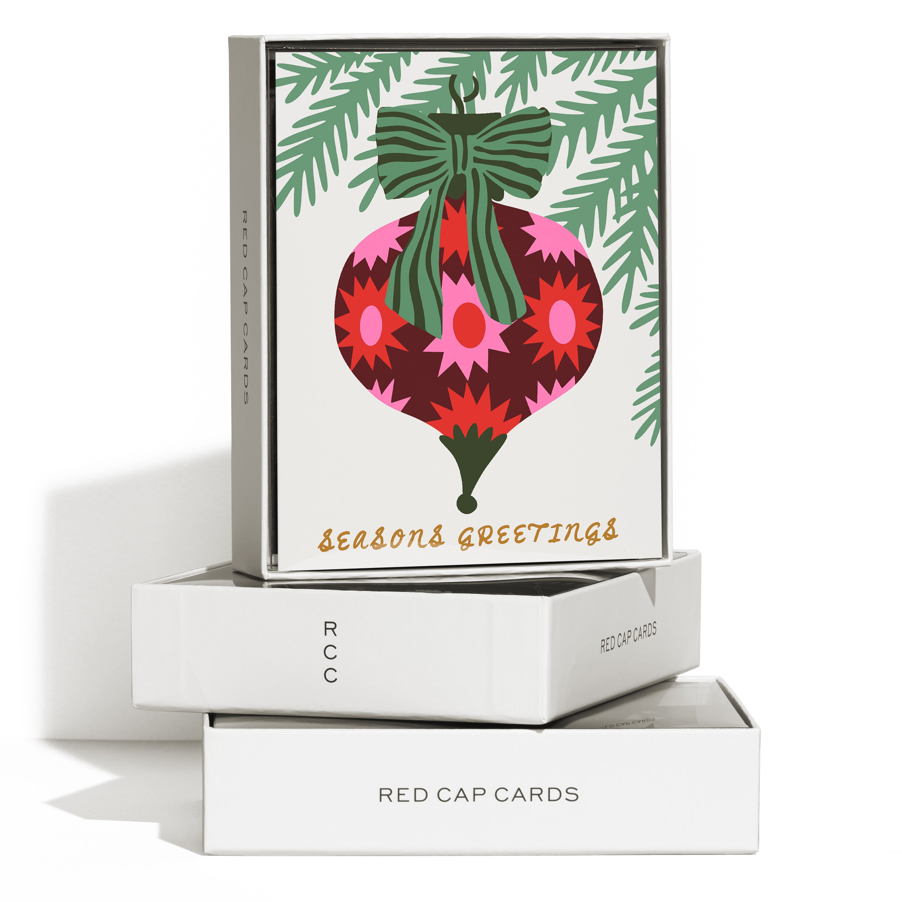 Boxed set of 8 Christmas cards with geometric colorful ornament design with 'Seasons Greetings' gold text.