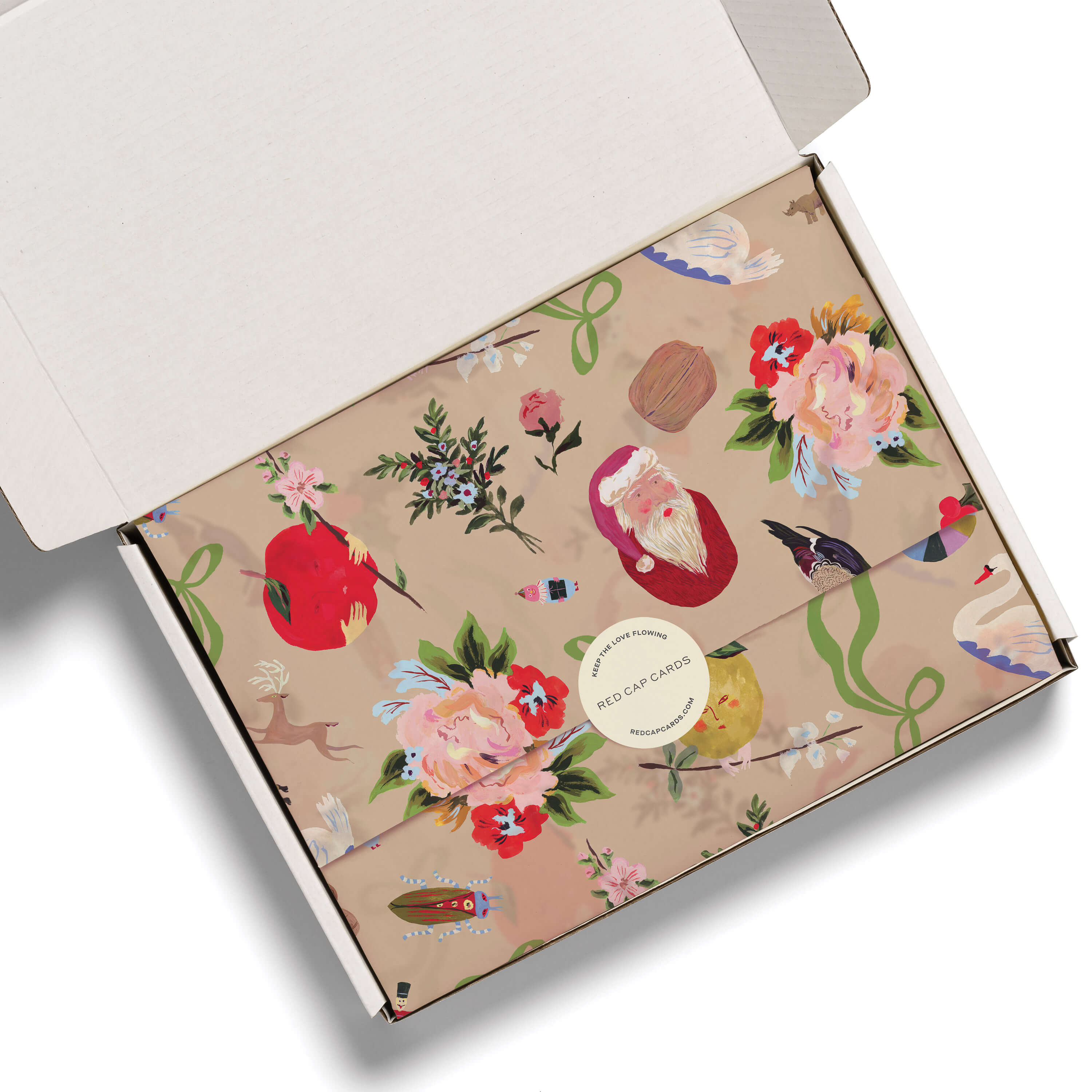 Beige Christmas themed tissue paper with classy festive designs in a white box.