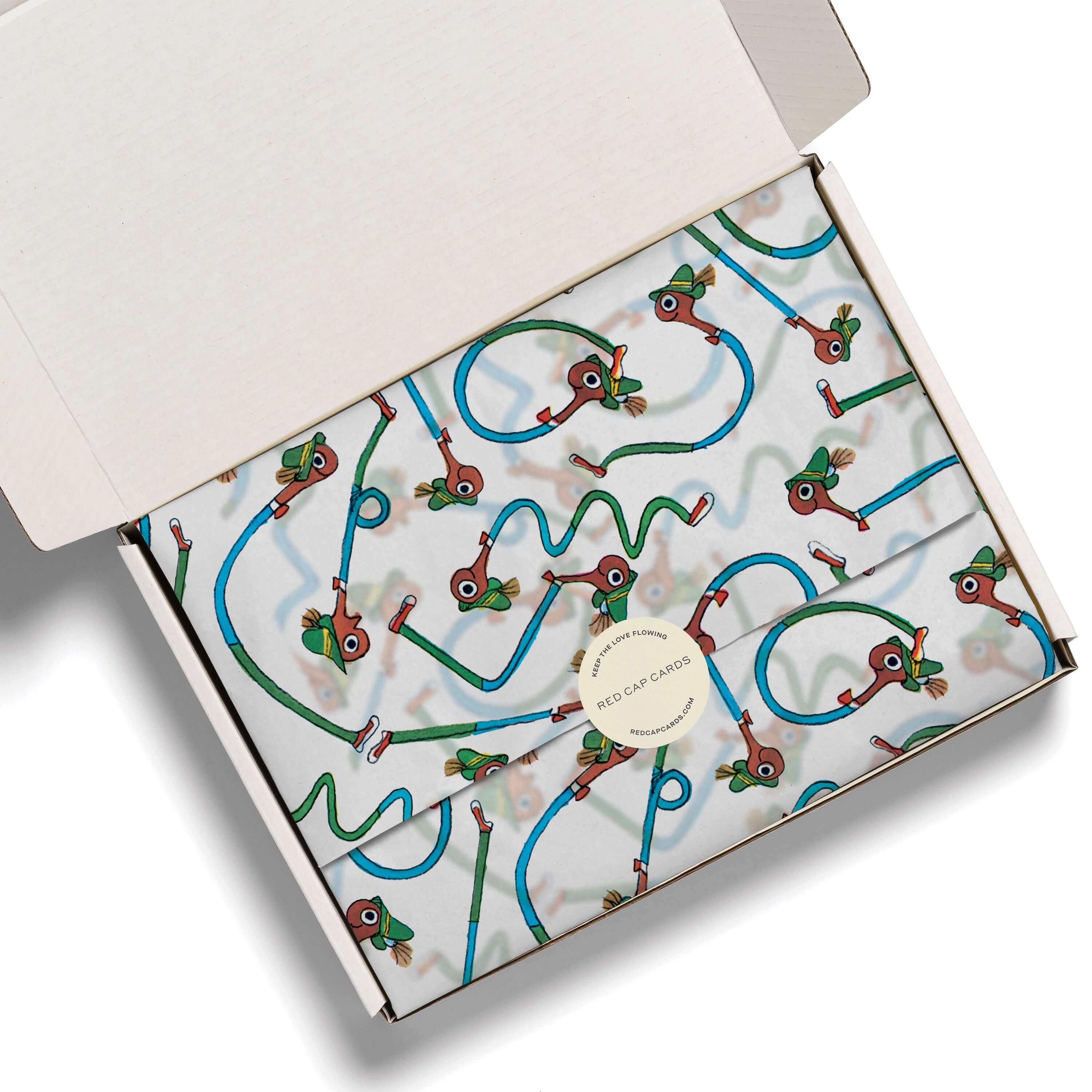 Tissue Paper with the Lowly Worm cartoon in different shapes design in a white gift box on a white background.